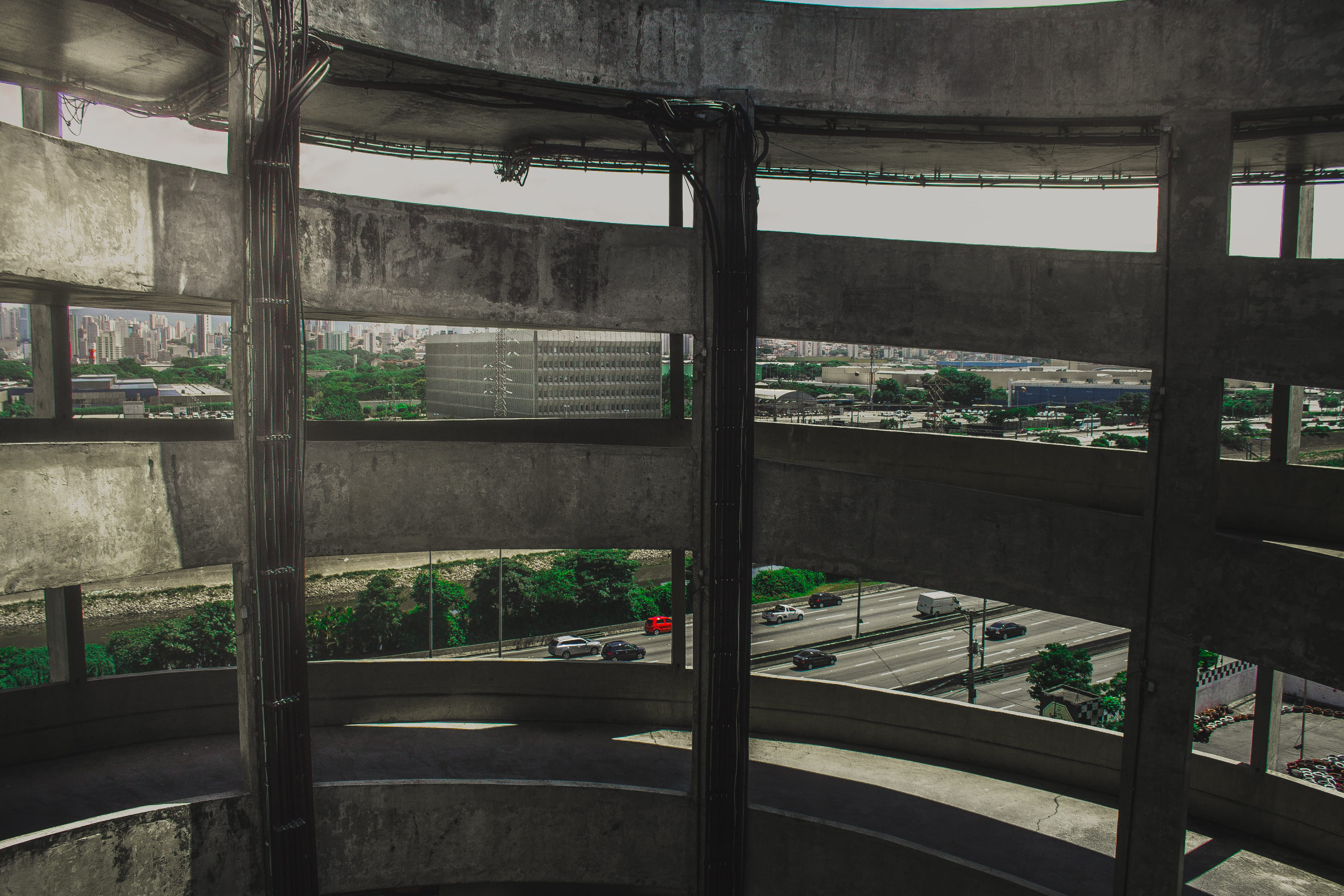 plant, cityscape, day, parking lot, city, environment, window frame, metal, outdoors, vehicles, urban, gray, pavement, 4K, greenhouse, automobile, transparent, HD Wallpaper