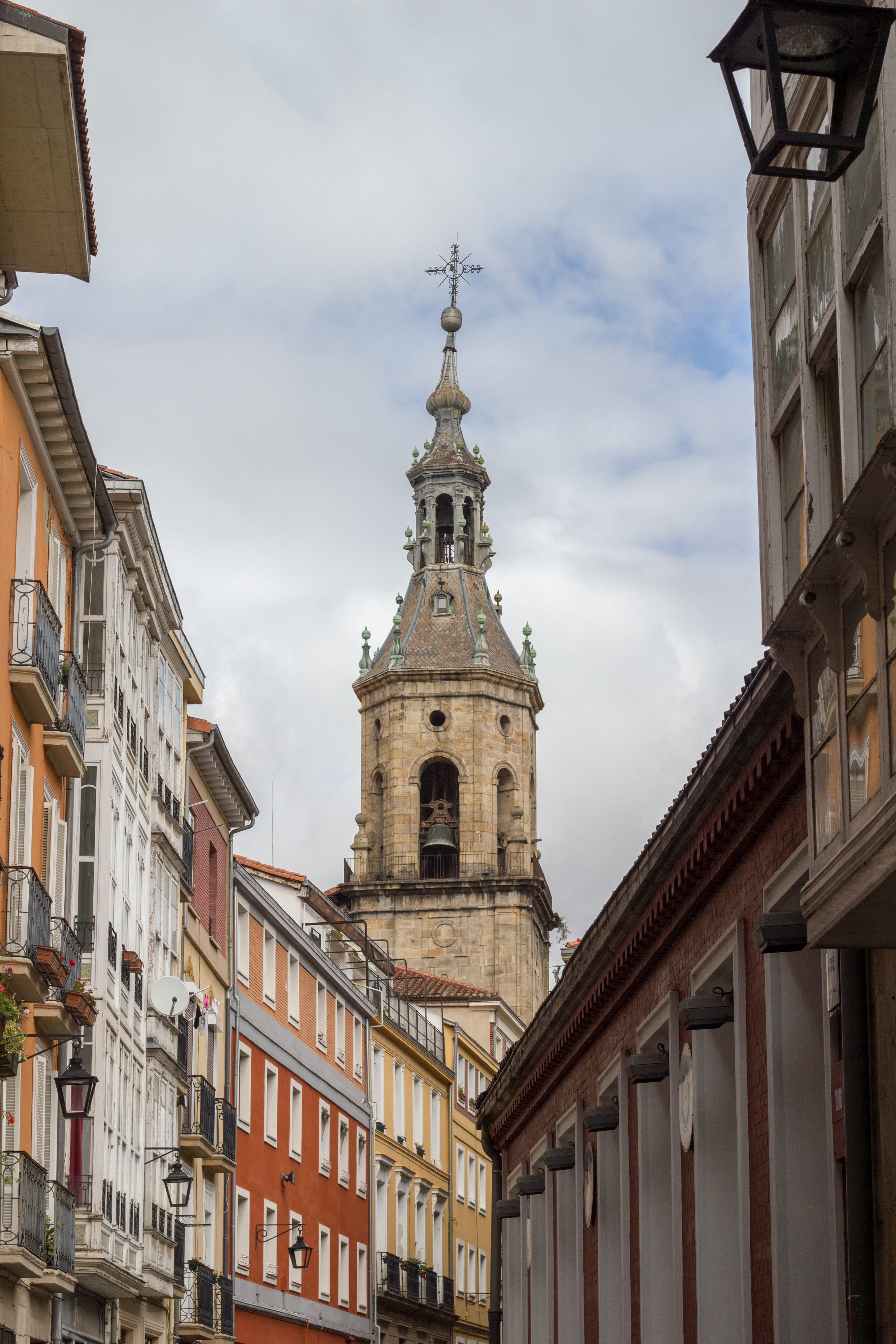 low angle view, outdoors, sky, alava, houses, spirituality, built structure, cloud - sky, cathedral, place of worship, architecture, 5K, bell tower, belief, Phone HD Wallpaper