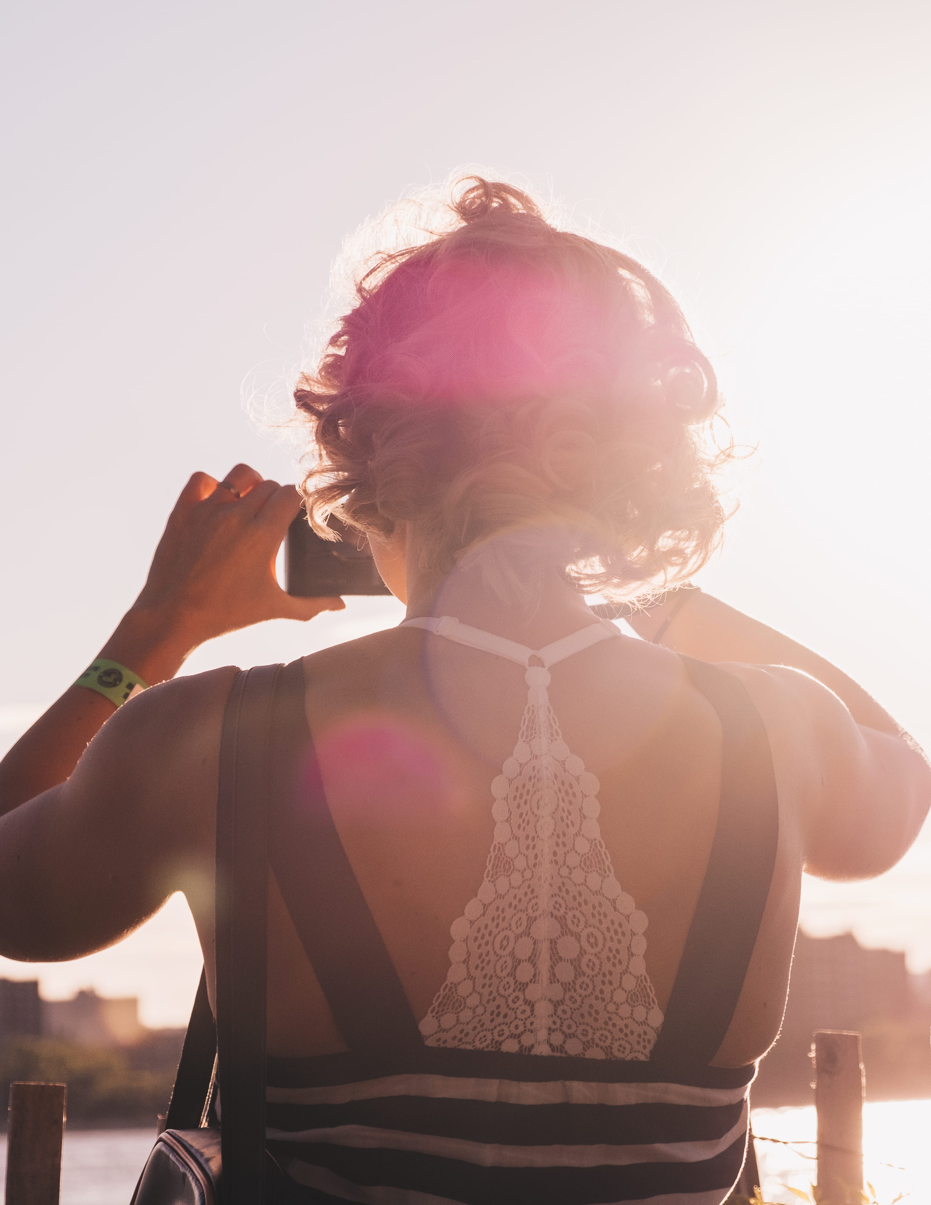 woman, black, sunrise, sun light, pose, style, holding, photo, urban, taking photo, fashion, dress, light, adult, sleeveless, person, looking out, lifestyles, Phone HD Wallpaper