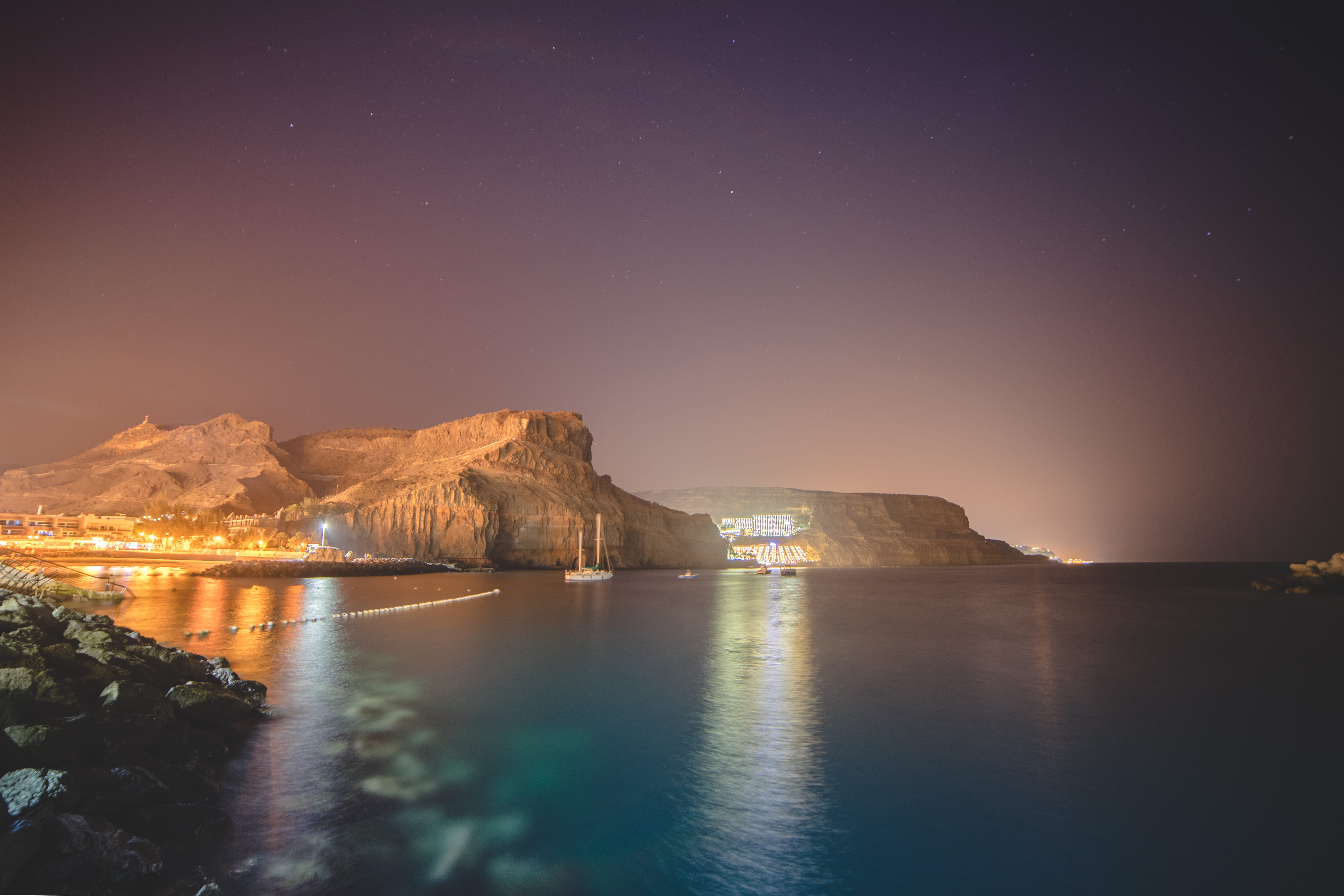 no people, boat, stones, night, scenics - nature, mogán, water, astronomy, sea, hotel, galaxy, reflection, idyllic, tranquility, sky, star - space, rocks, HD Wallpaper