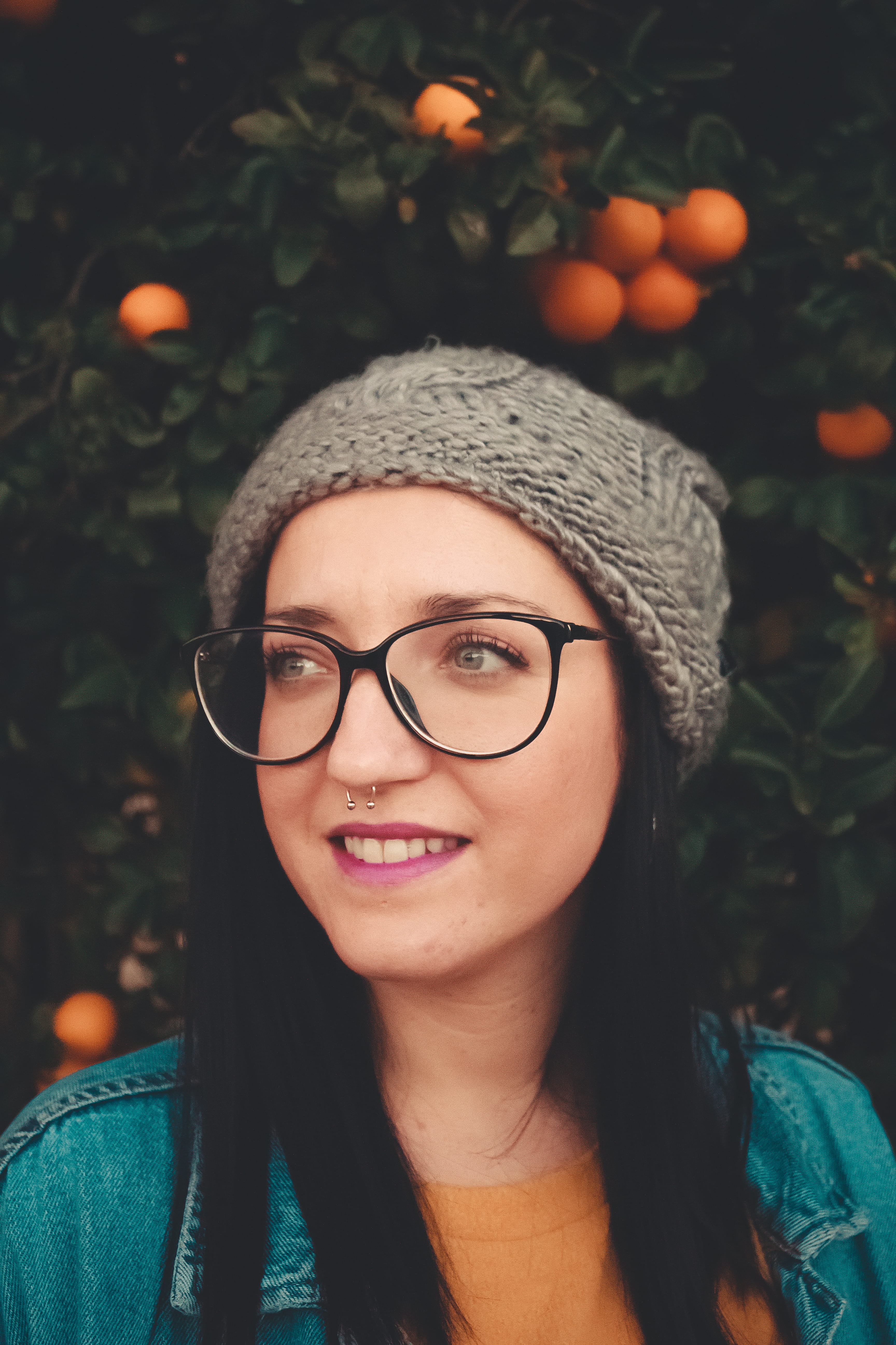 close-up, focus on foreground, outdoors, apparel, front, produce, hairstyle, fruits, real people, person, coat, cap, citrus fruit, woman, food, accessories, Phone HD Wallpaper