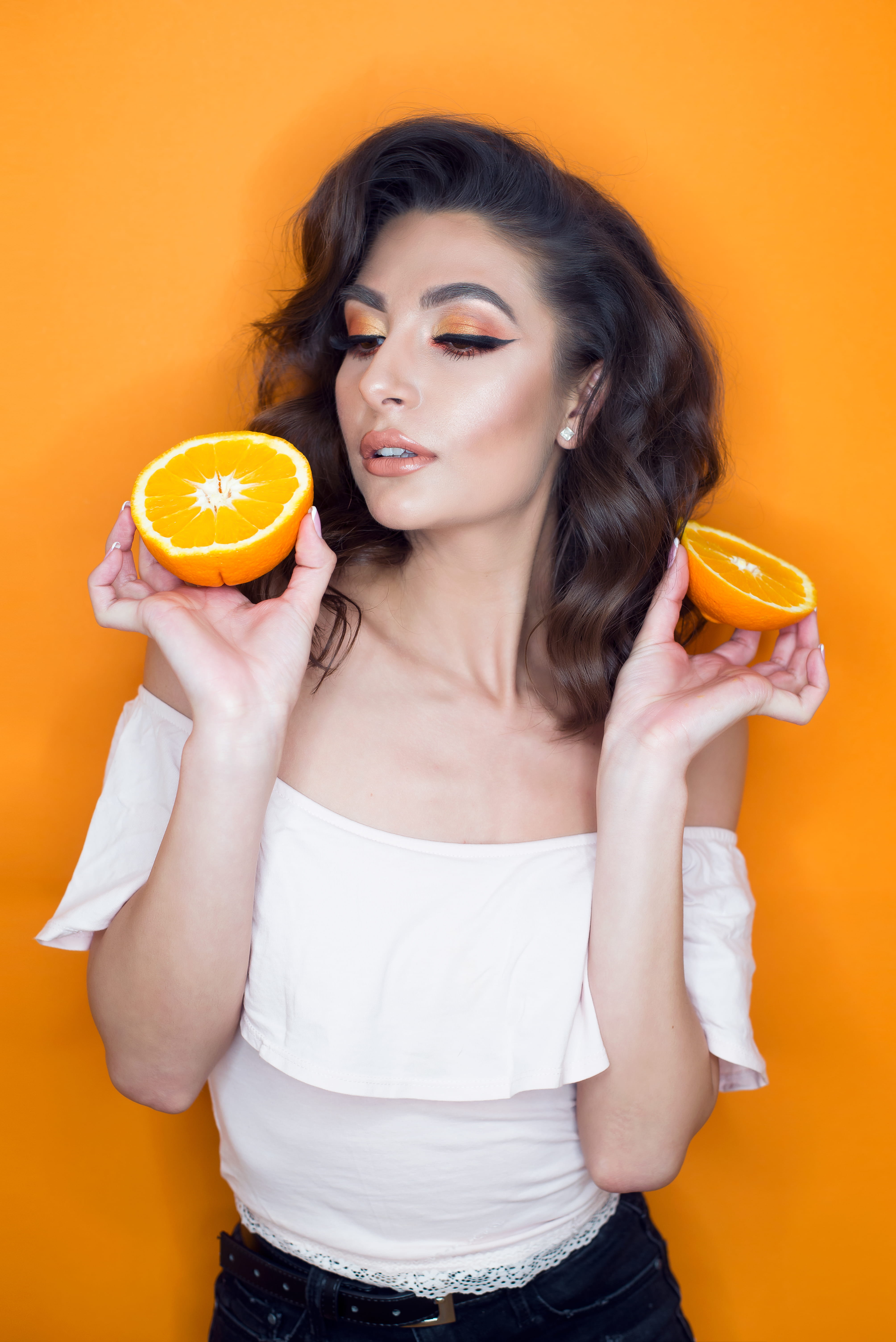citrus fruit, food and drink, studio shot, hair, person, beautiful woman, healthy lifestyle, holding, women, fruit, plant, apparel, one person, orange color, Phone HD Wallpaper