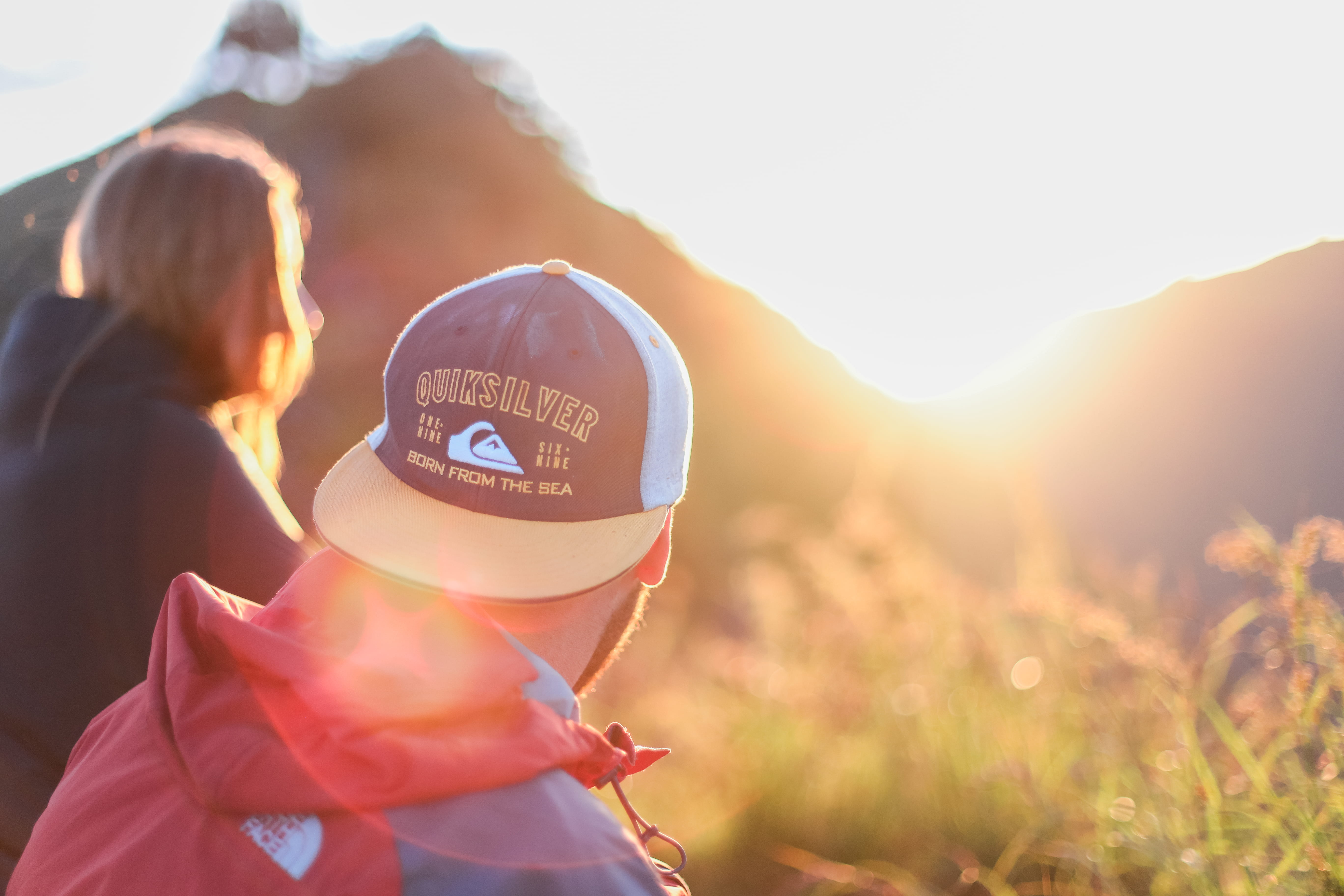 back lit, couple, lifestyles, people, women, looking, wearing, sunny, rise, adult, sun, outdoors, land, beauty in nature, face, lens flare, sunset, emotion, HD Wallpaper