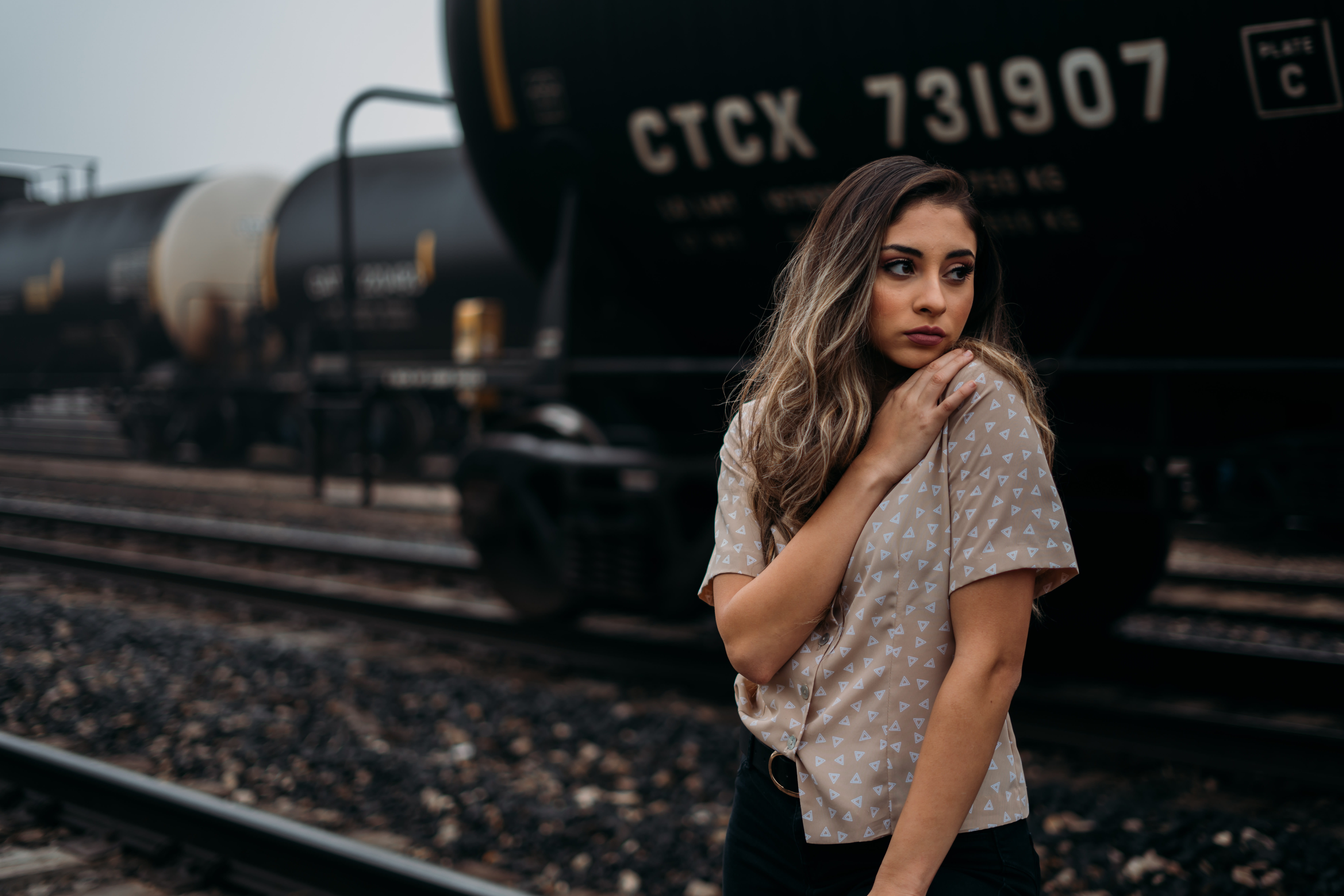 track, gown, standing, railroad track, real people, railroad station, shipping container, travel, fashion, young adult, long sleeve, train, woman, robe, HD Wallpaper