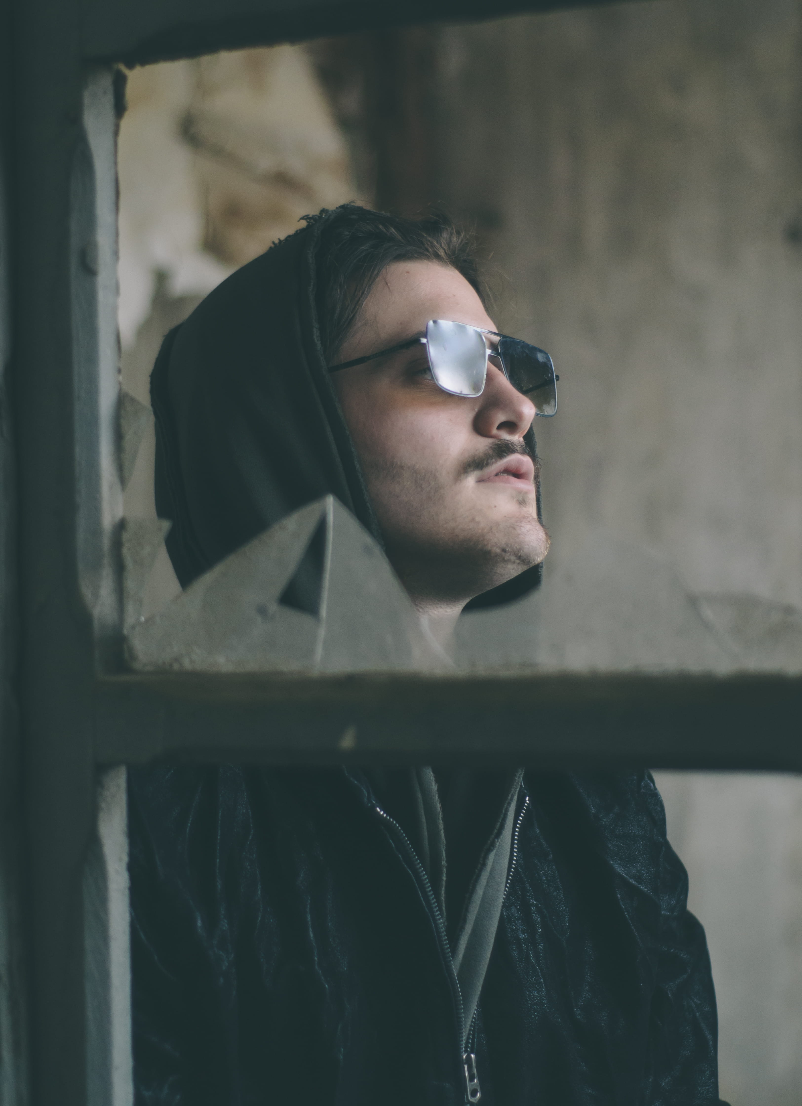 sweater, goggles, human, young adult, man, accessory, young men, light, sunglasses, black, hood, lifestyles, looking, apparel, indoors, real people, casual clothing, Phone HD Wallpaper