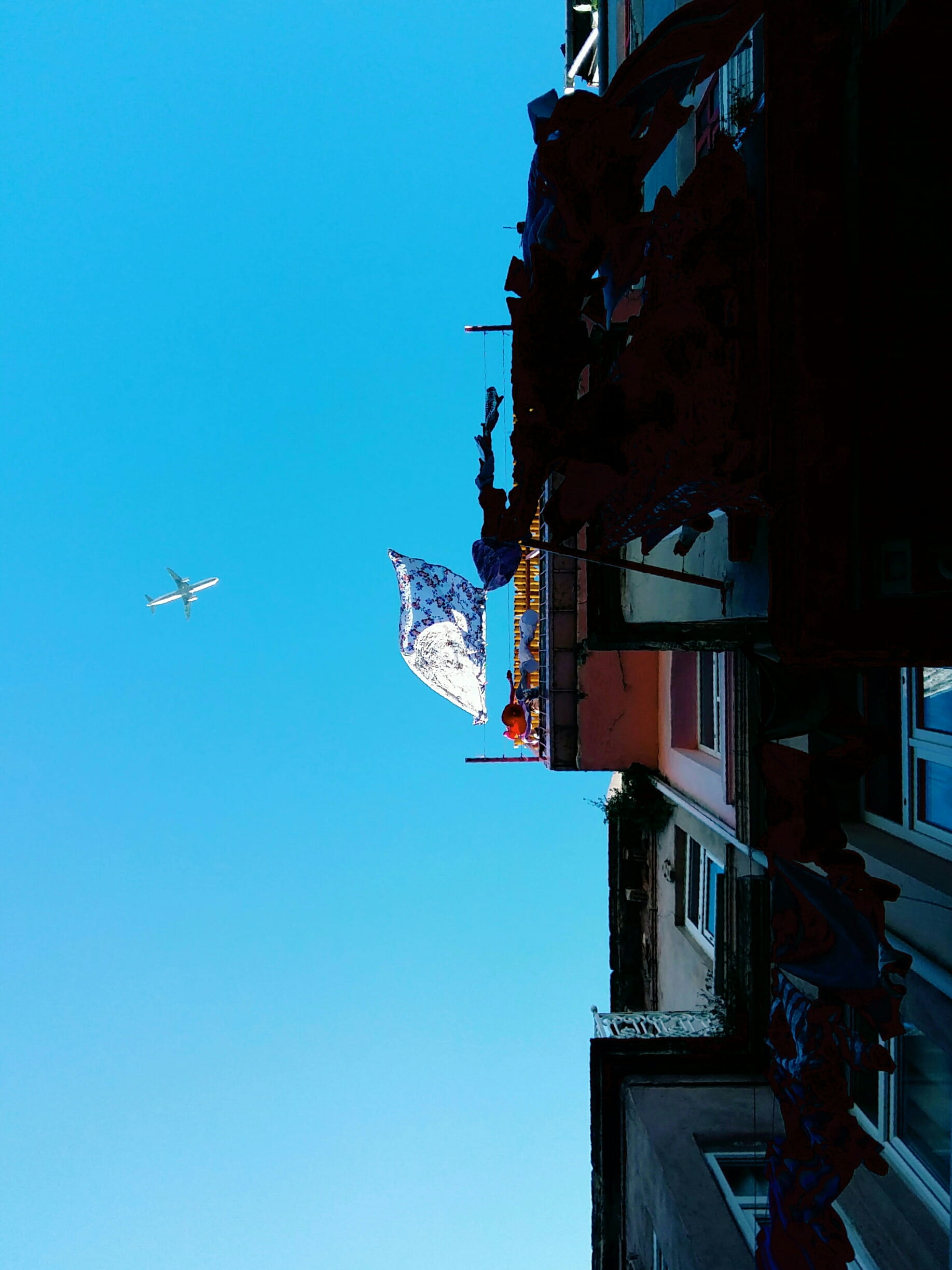 built structure, city, travel, blue, clear sky, plane, mode of transportation, low angle view, nature, day, 1080P, outdoors, sky, mid-air, angle, no people, Phone HD Wallpaper