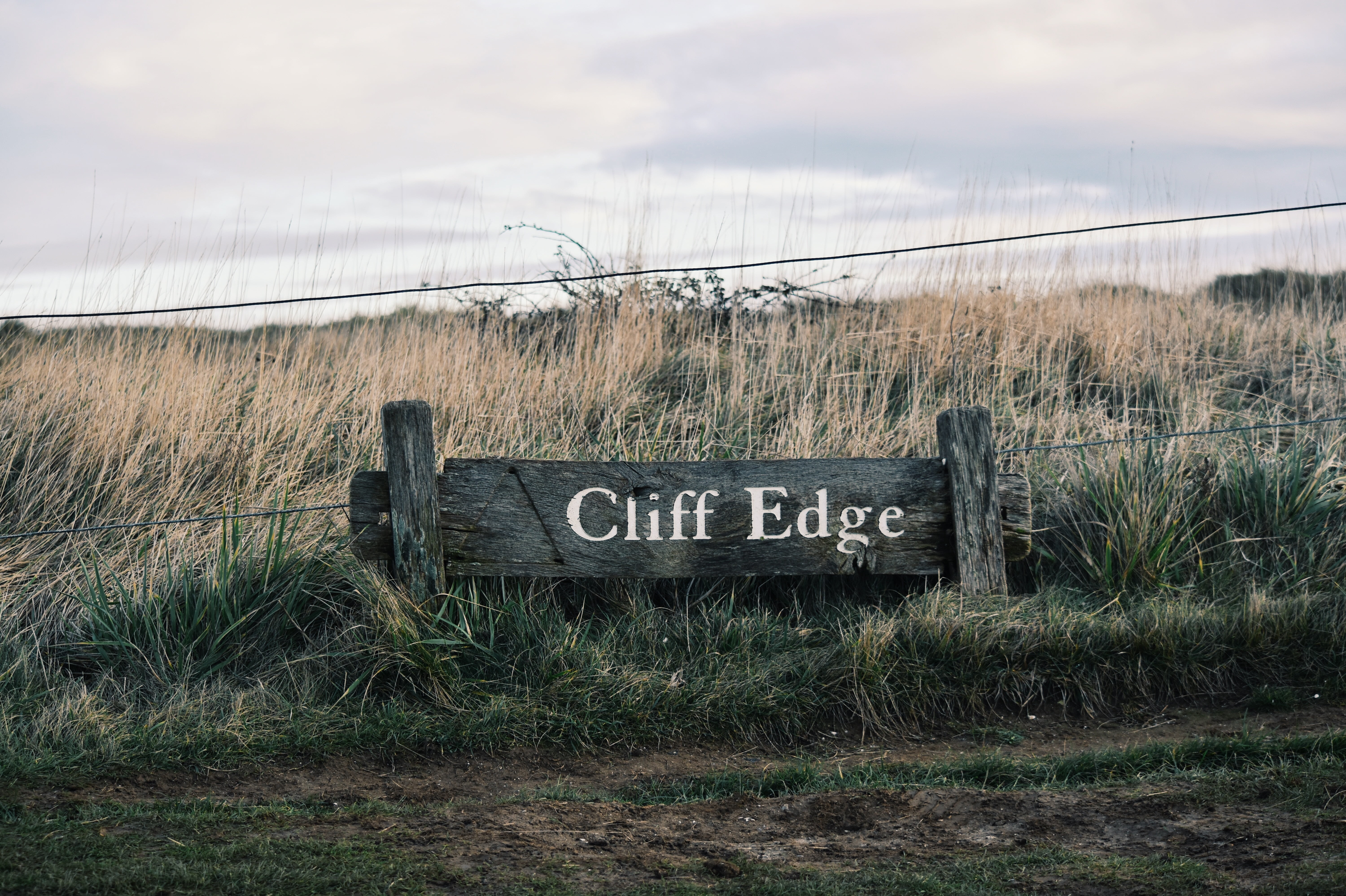 no people, sign, outdoors, information, grass, 5K, signage, field, communication, signboard, nature, text, tranquility, edge, cliff, barrier, inscription, HD Wallpaper