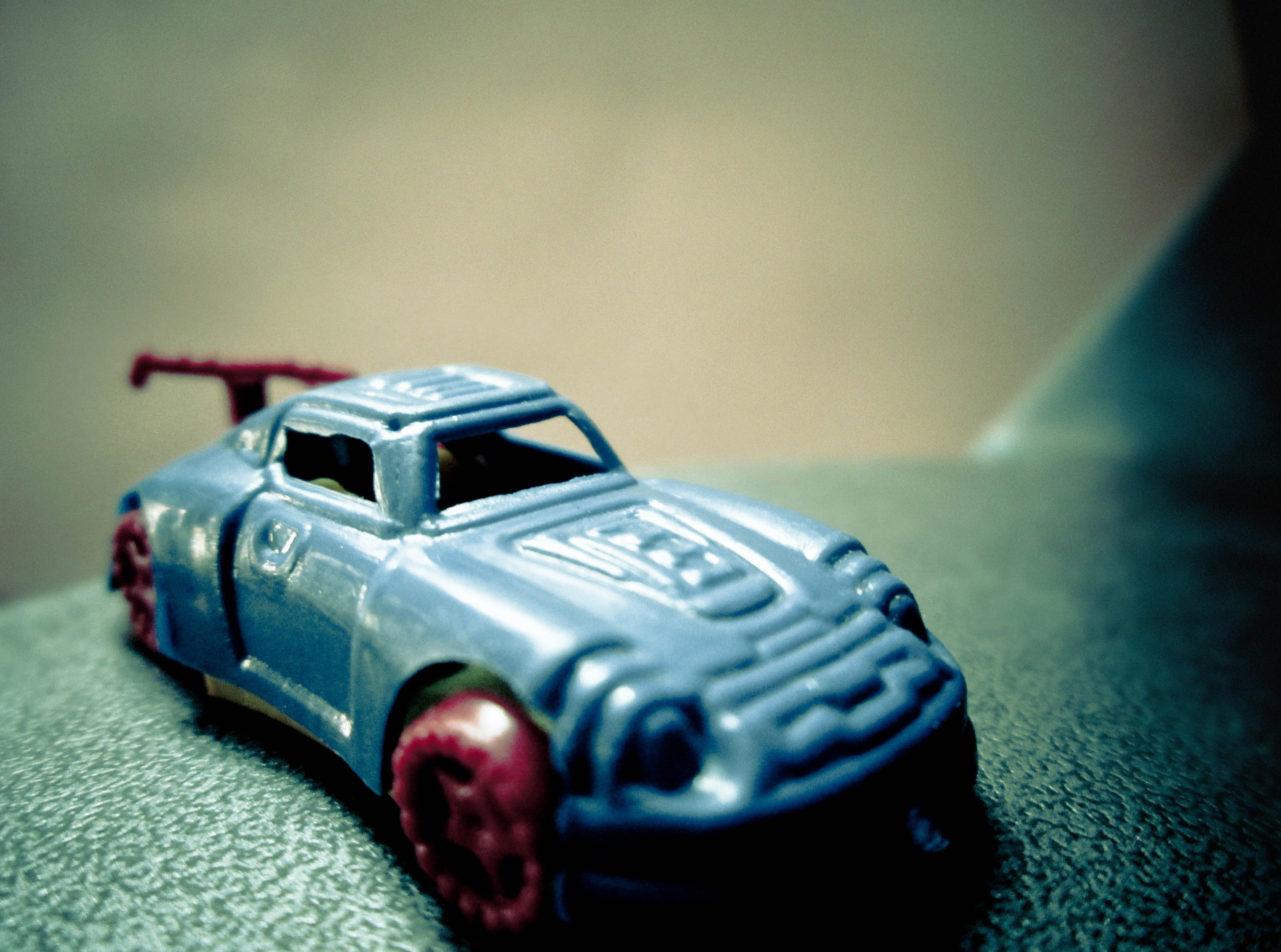 racecar, indoors, Dark, car, security, toy car, gray, mode of transportation, blue car, no people, small, cast, sport, Vintage, urgency, single object, HD Wallpaper