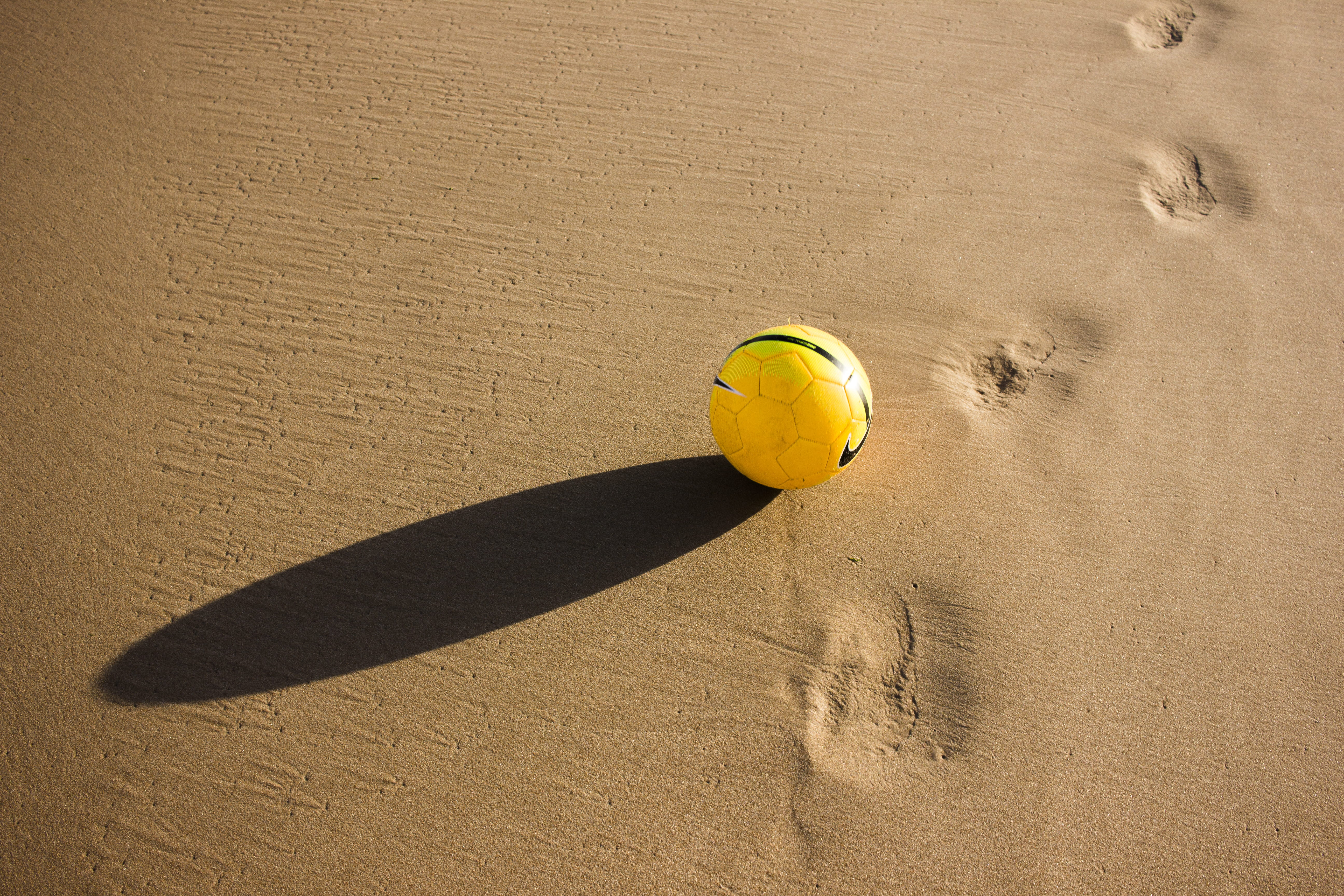 sphere, sunlight, high angle view, sport, ball, 5K, nature, beach, sports equipment, gray, daytime, yellow, single object, shadow, tennis ball, football, HD Wallpaper