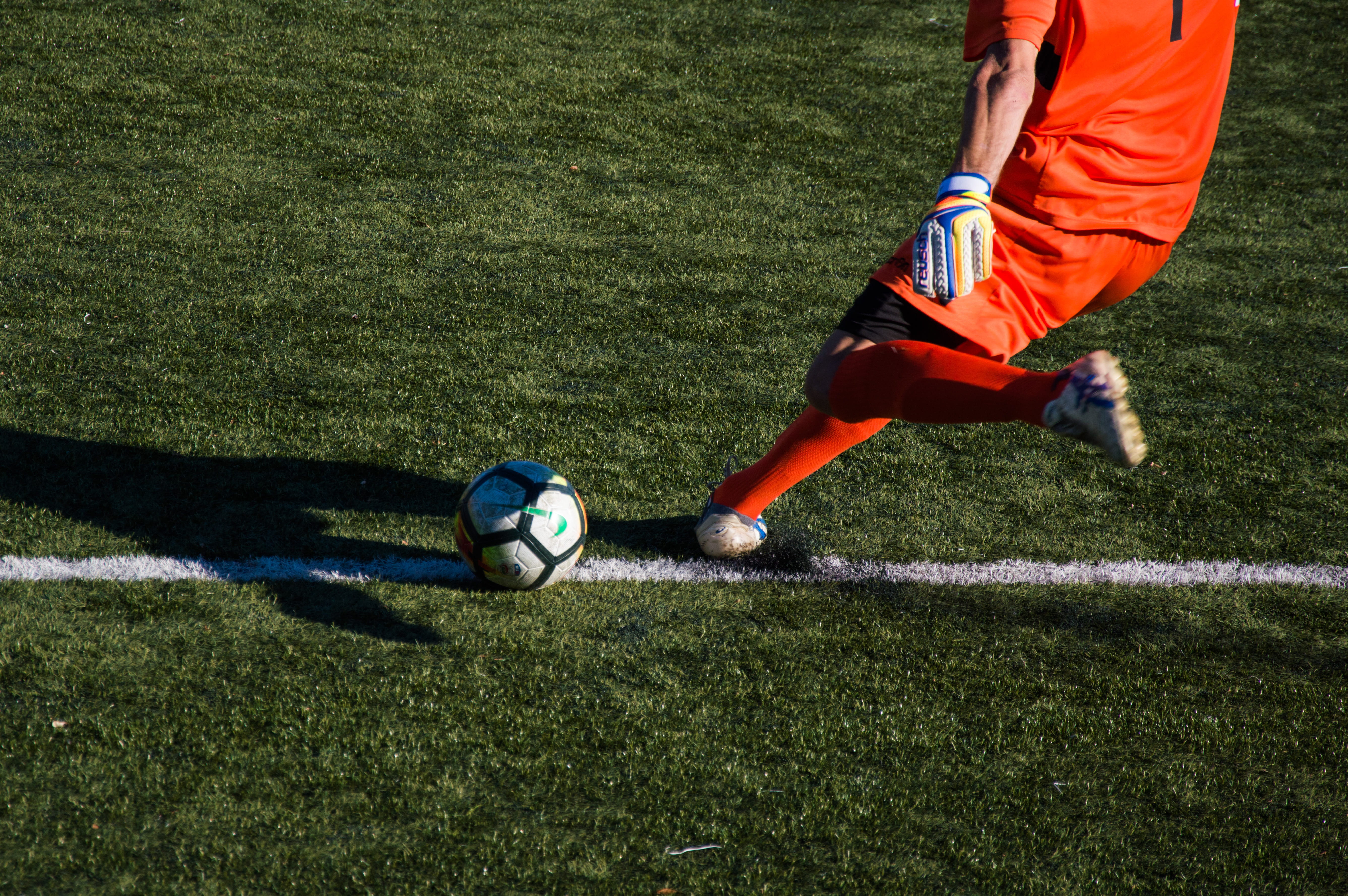 soccer player, soccer, shadow, goalkeeper, skill, person, motion, people, male, composition, sports equipment, outdoors, plant, turf, team sport, sports uniform, HD Wallpaper