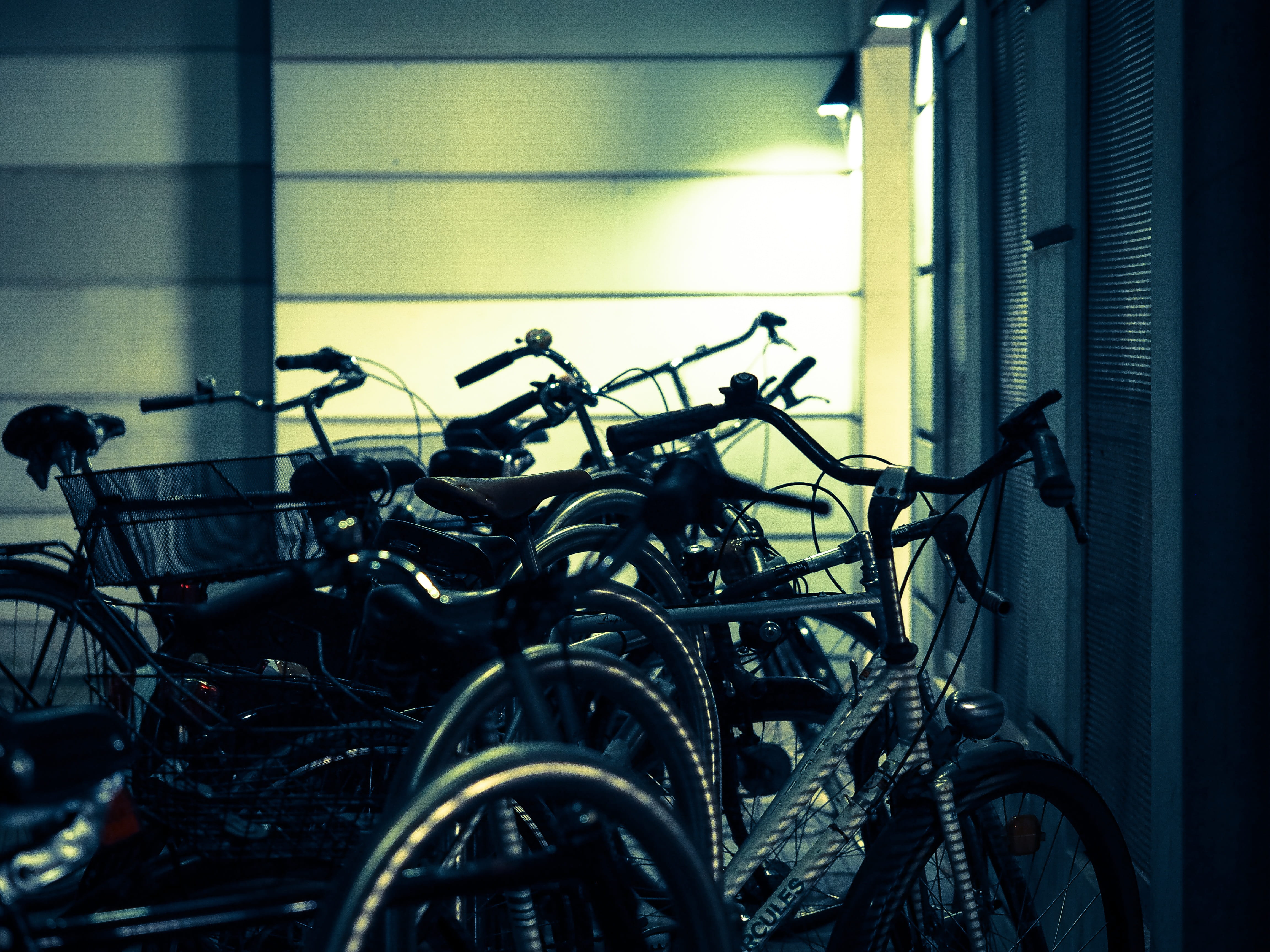 focus on foreground, architecture, chrome, no people, bicycle, Bike Racks, day, wall, parking, built structure, close-up, lined up, bike, steel, parking lot, HD Wallpaper