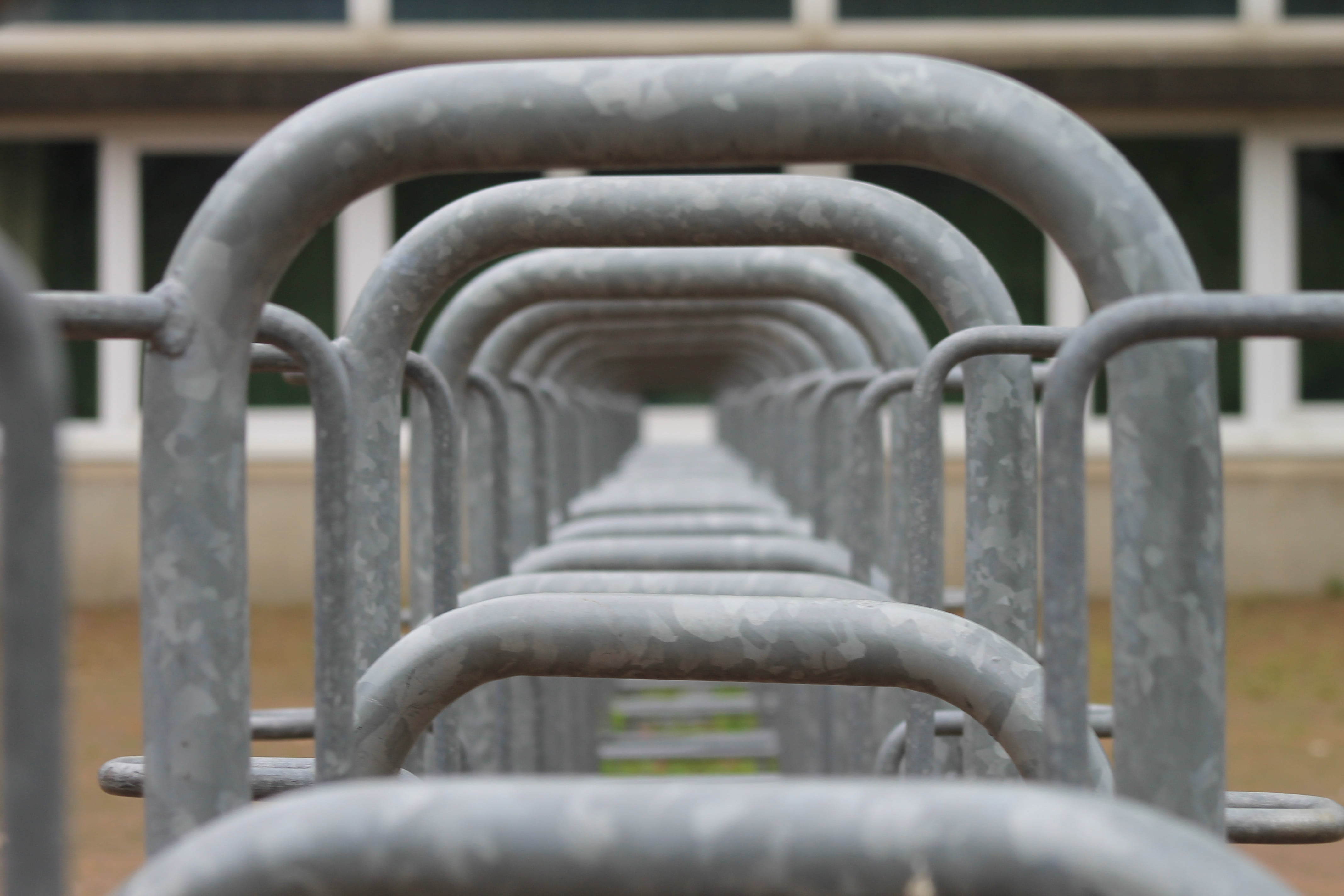 metal, pattern, built structure, close-up, school, empty, by looking, in a row, bike racks, arch, repetition, 4K, connection, nature, outdoors, focus on foreground, HD Wallpaper