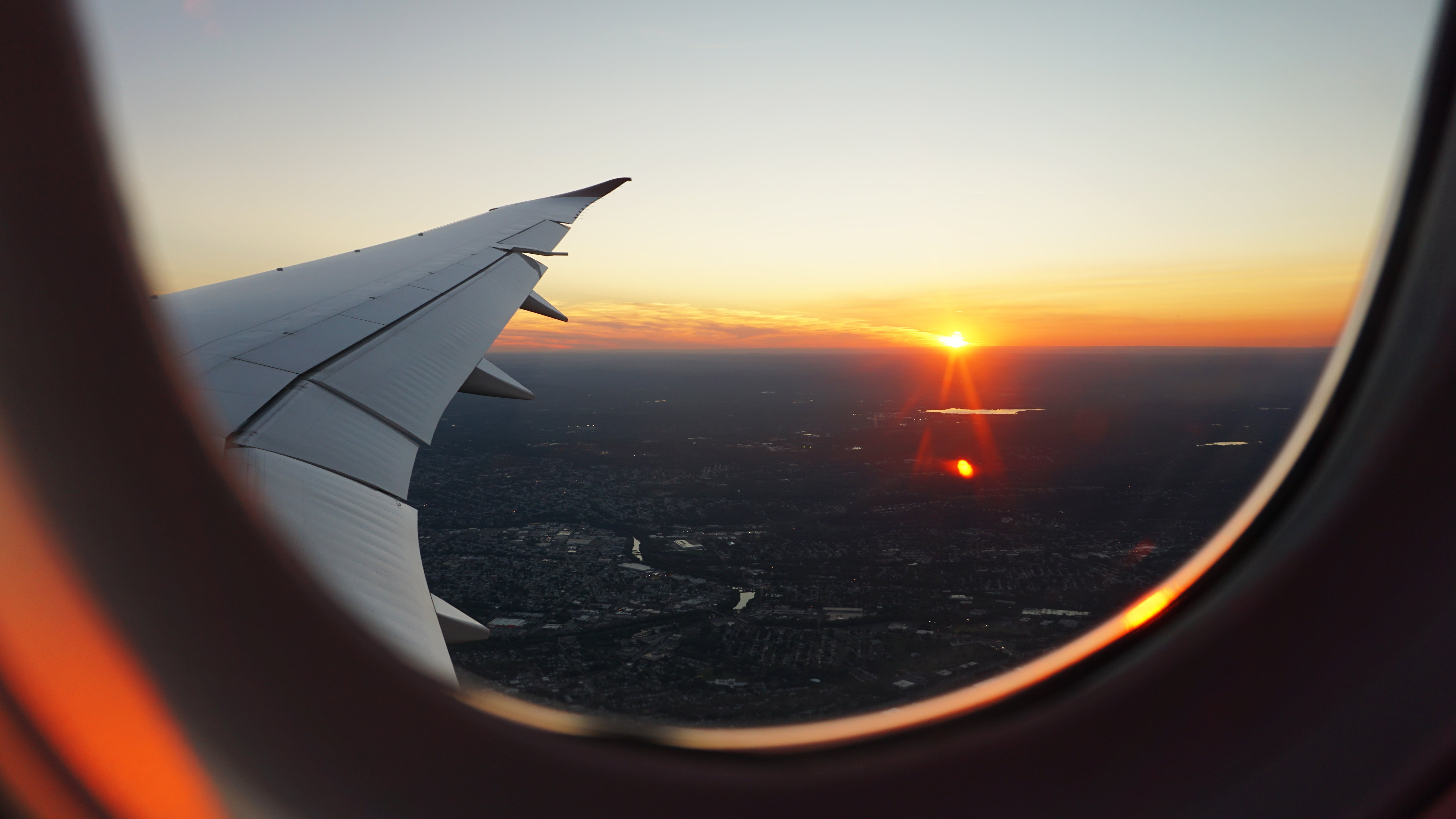 beauty in nature, sky, nature, aerial view, cityscape, transportation, clouds, righwing, sunlight, lens flare, adventure, flying, city, aircraft wing, no people, HD Wallpaper