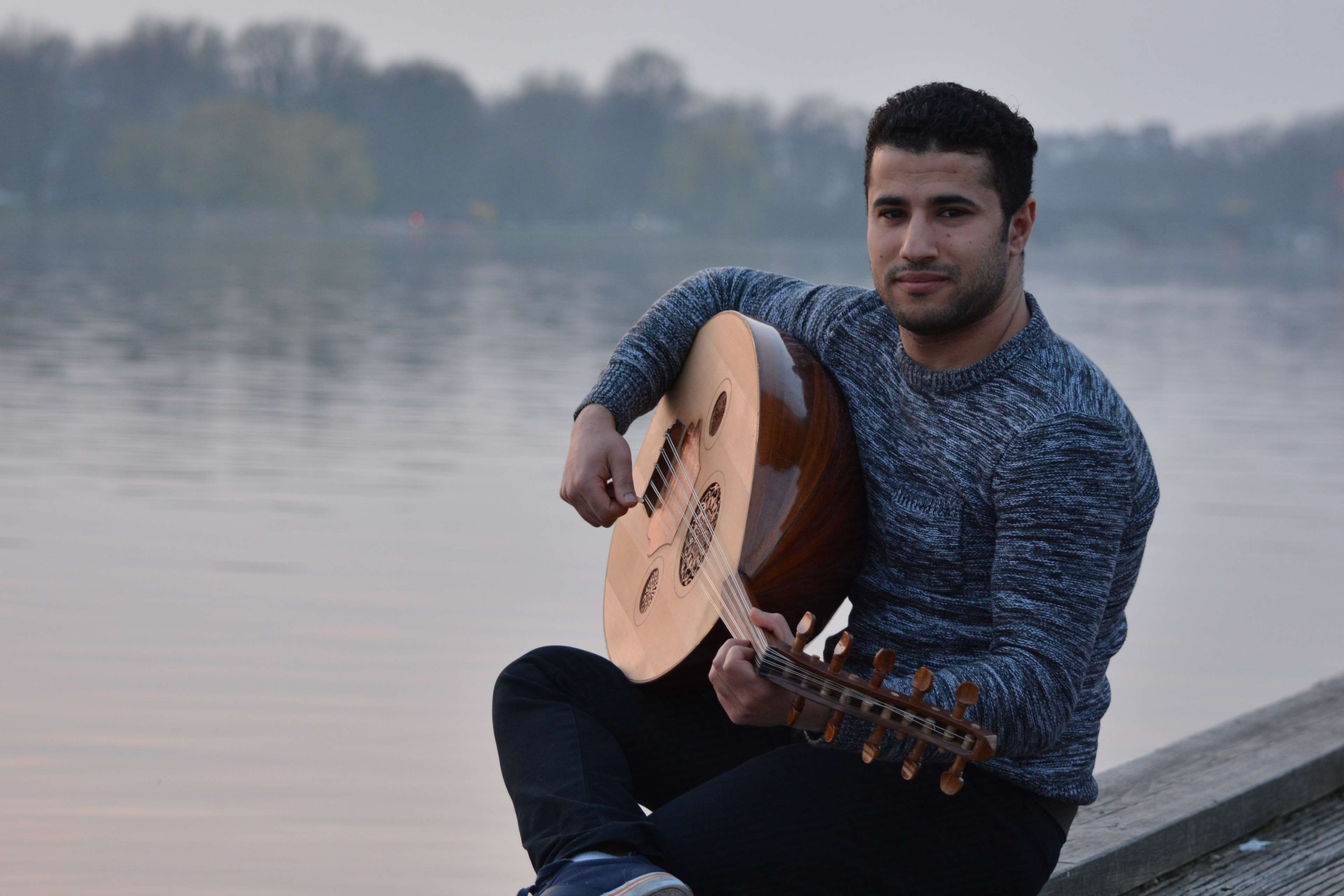 musical equipment, sitting, music, playing, musical instrument, outdoors, guitar, plucking an instrument, smile, lake, water, one person, young adult, leisure activity, HD Wallpaper