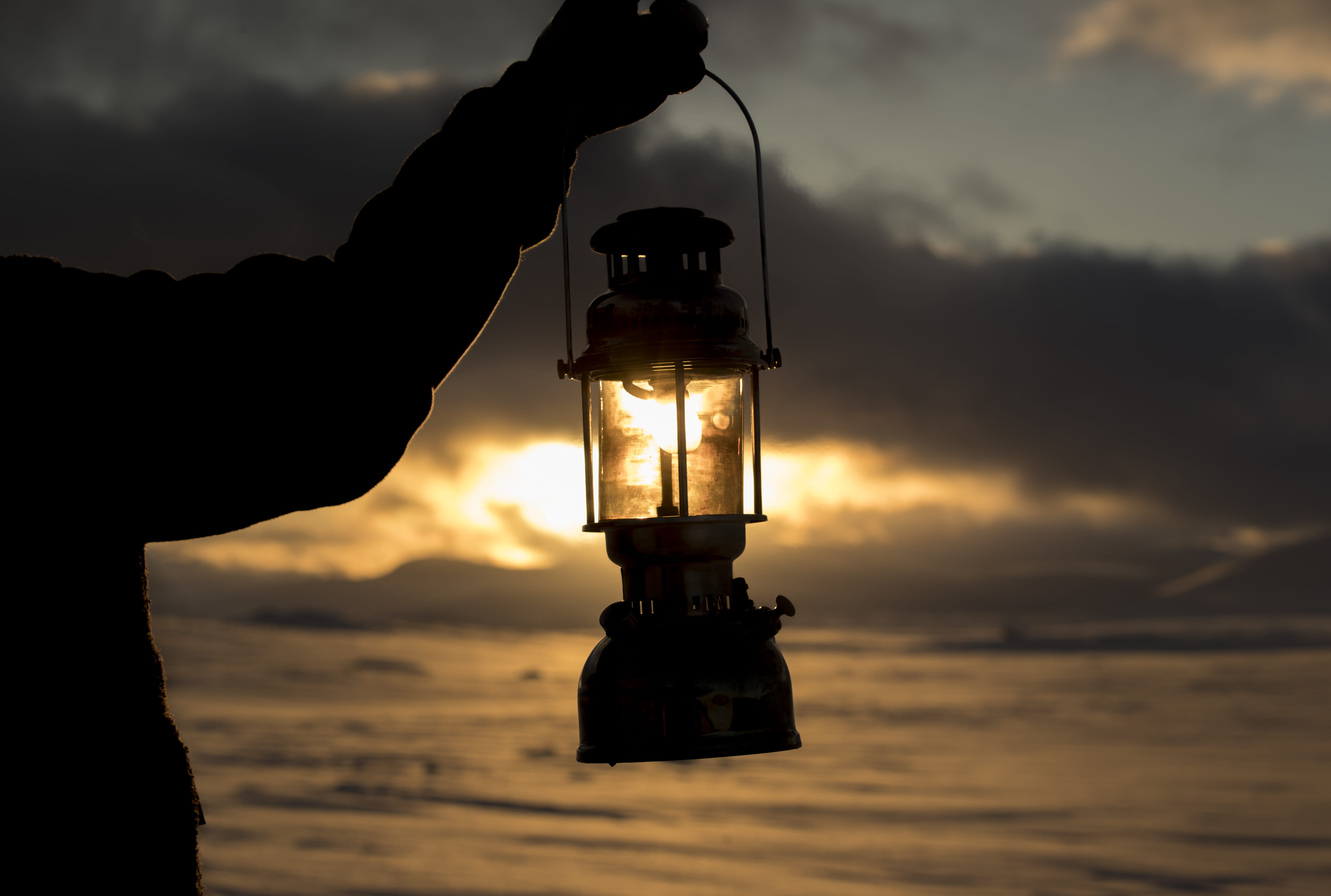 kerosene, cloud - sky, real people, outdoors, nature, sunset, human body part, standing, sky, light bulb, lamp, human hand, 5K, silhouette, lighting equipment, HD Wallpaper