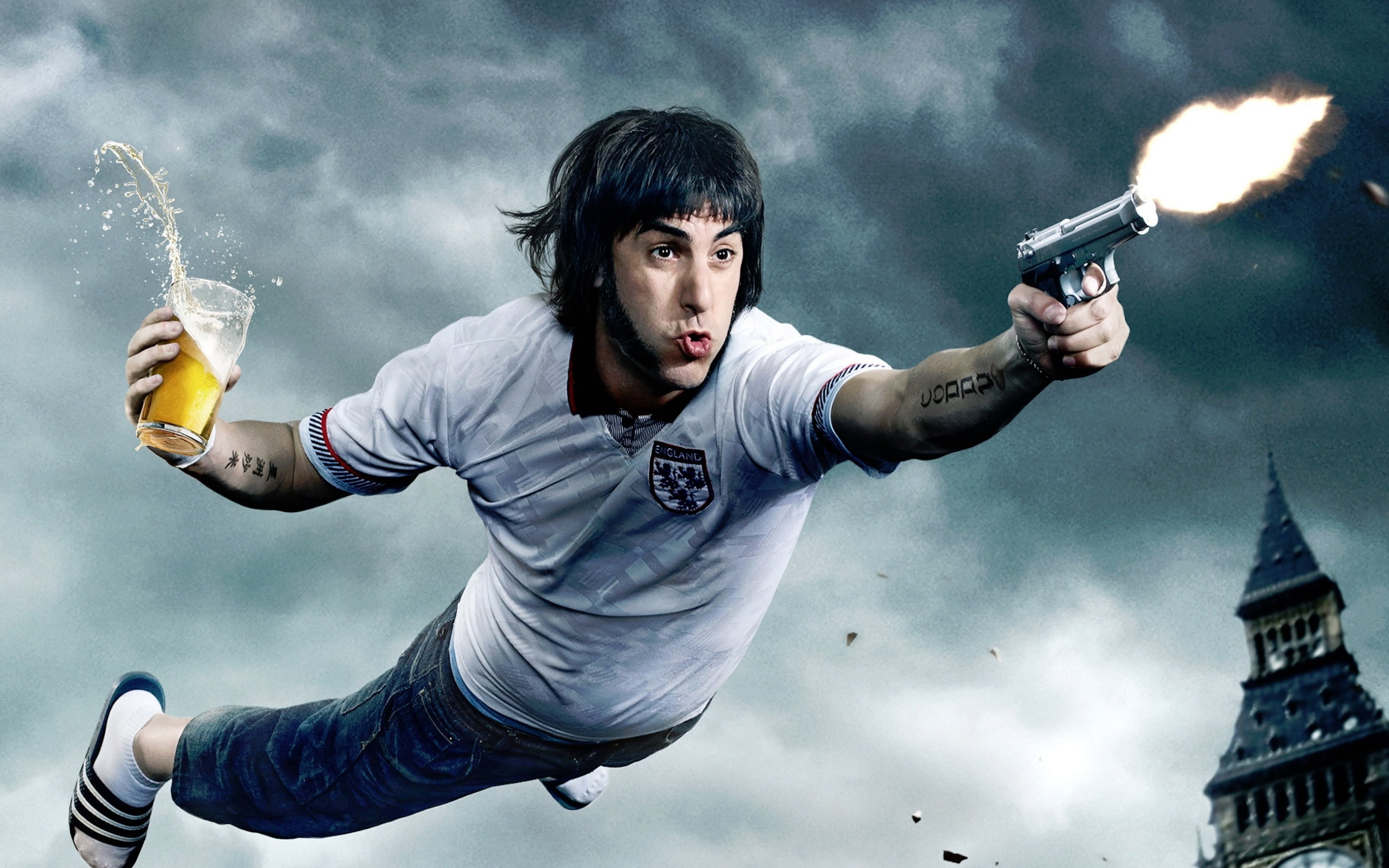cohen, nature, baron, cloud - sky, Hollywood Movies, architecture, sacha baron cohen, looking at camera, holding, young men, 2016, weapon, motion, communication, HD Wallpaper