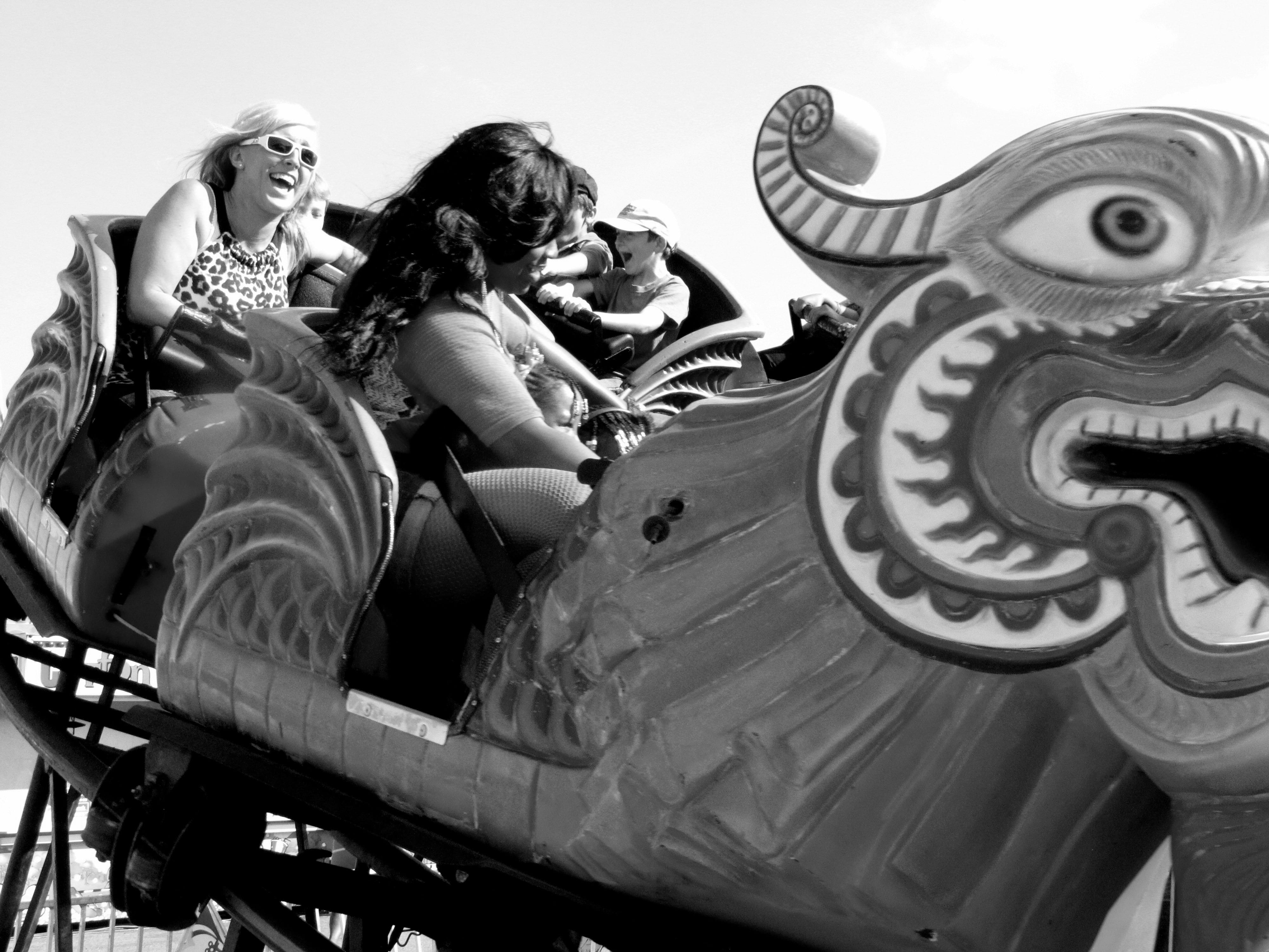 funfair, smiling, fairground, architecture, recreation, enjoyment, sitting, happiness, carousel, joy, females, extravaganza, rollercoaster, childhood, mouth open, HD Wallpaper