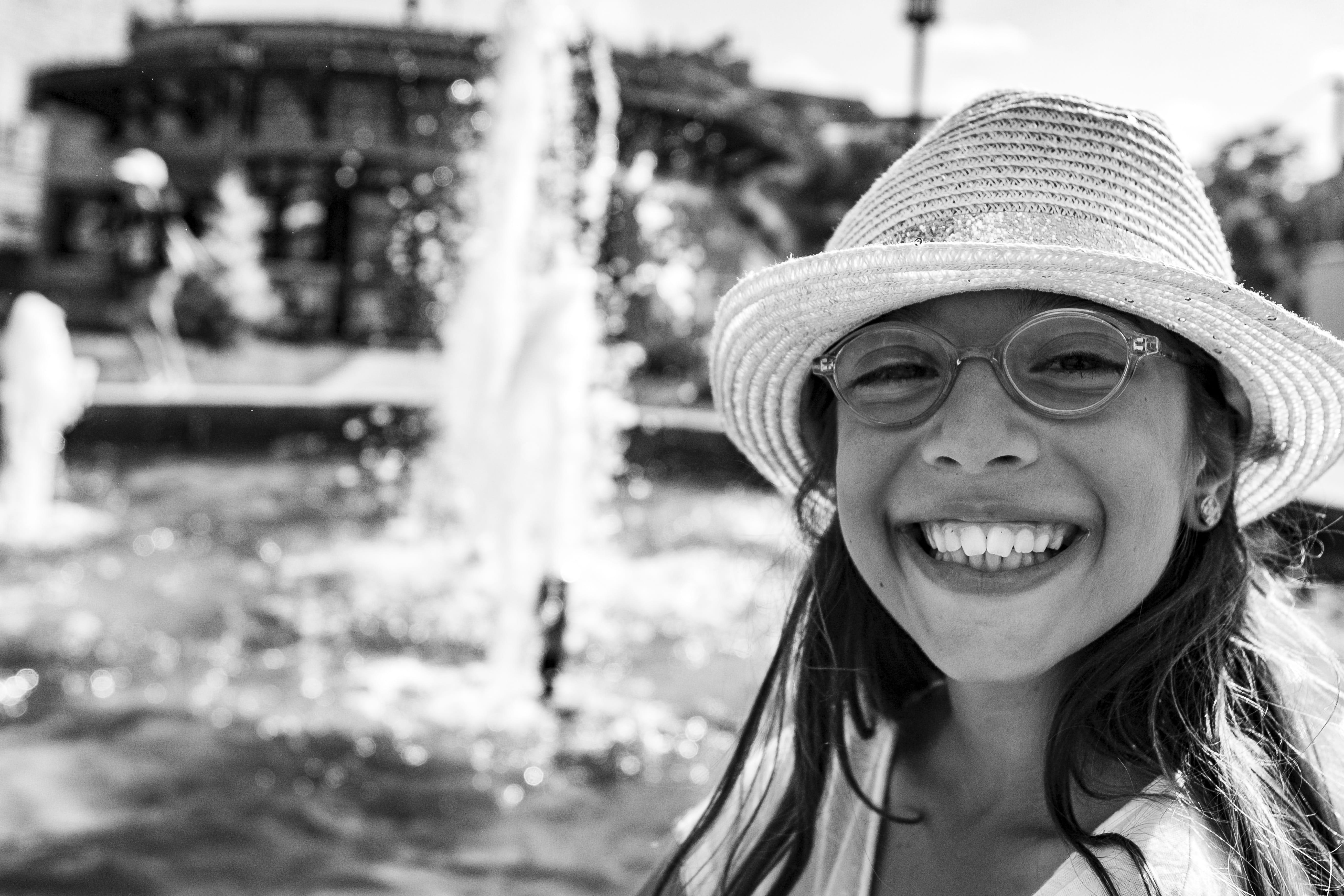 enjoyment, portrait, cheerful, 5K, sille, fountain, water, happiness, black and white, sun hat, kids, focus on foreground, emotion, photo, toothy smile, HD Wallpaper