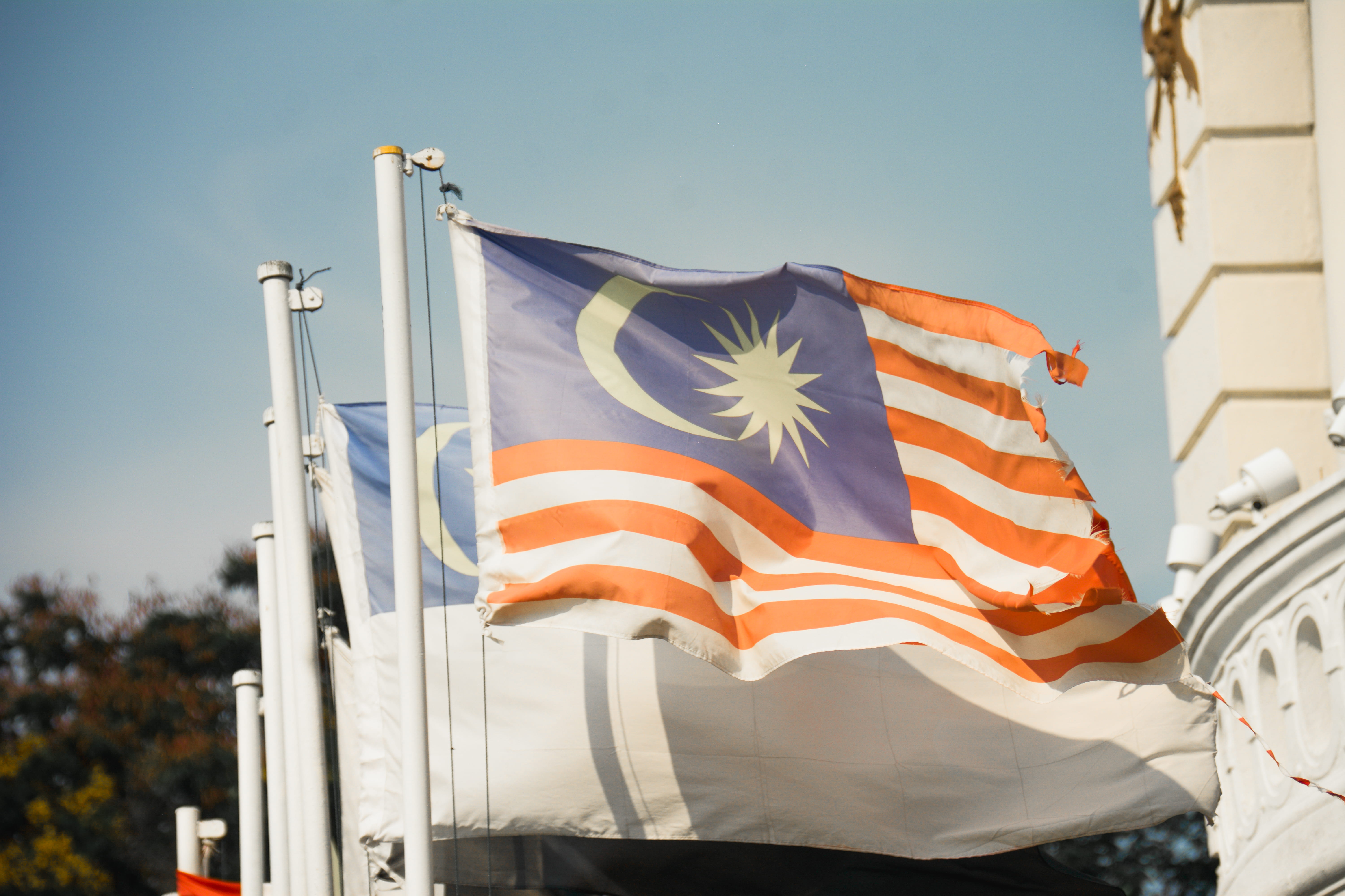 daylight, patriotism, Malaysia, no people, star shape, environment, assorted, nature, waving, Malaysian flag, wind, flag, low angle view, flagpole, independence, HD Wallpaper