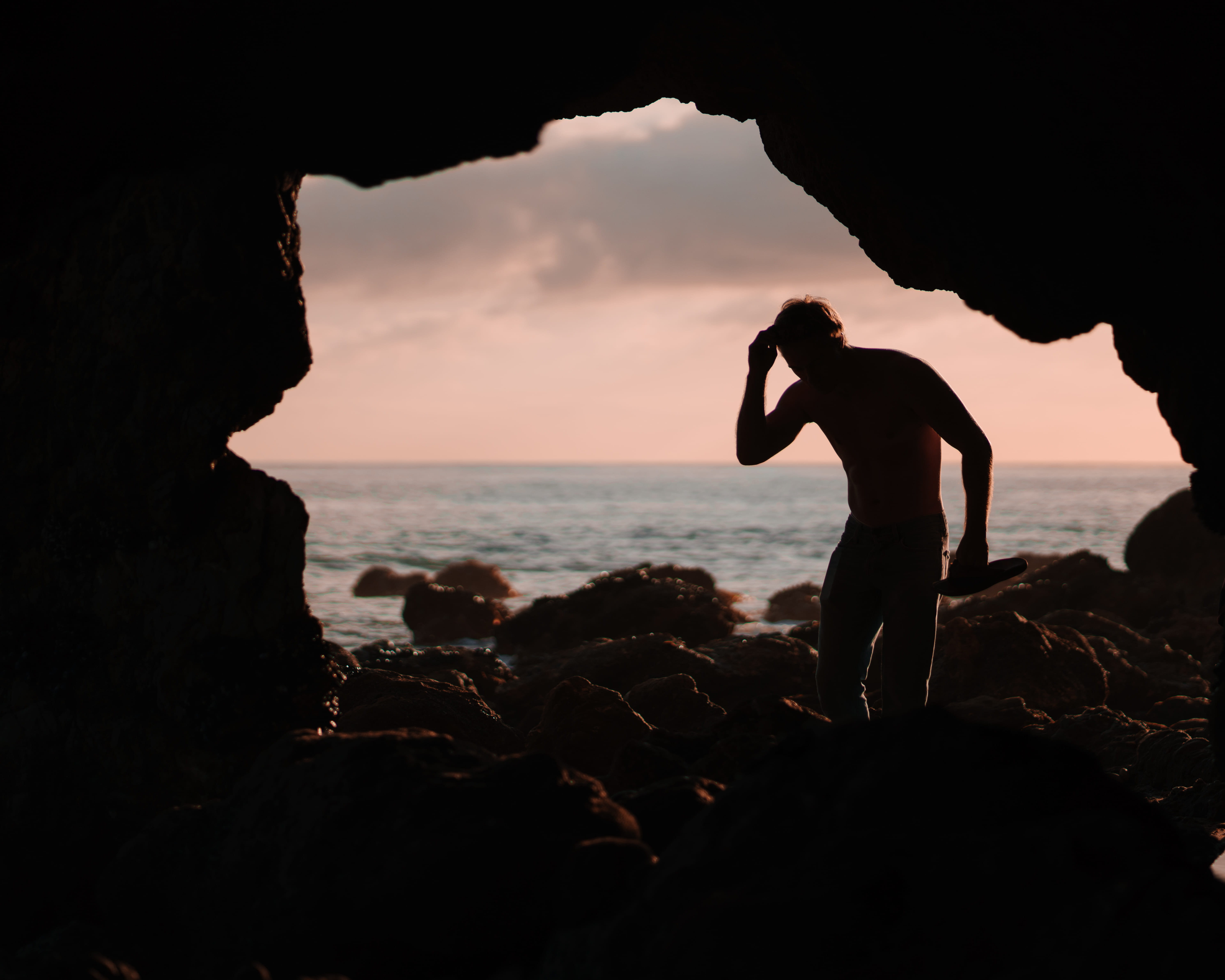 sea, outdoors, sunset, people, leisure activity, rock, sky, horizon over water, water, leisure activities, back, caveman, ocean, sport, adventure, beach, HD Wallpaper