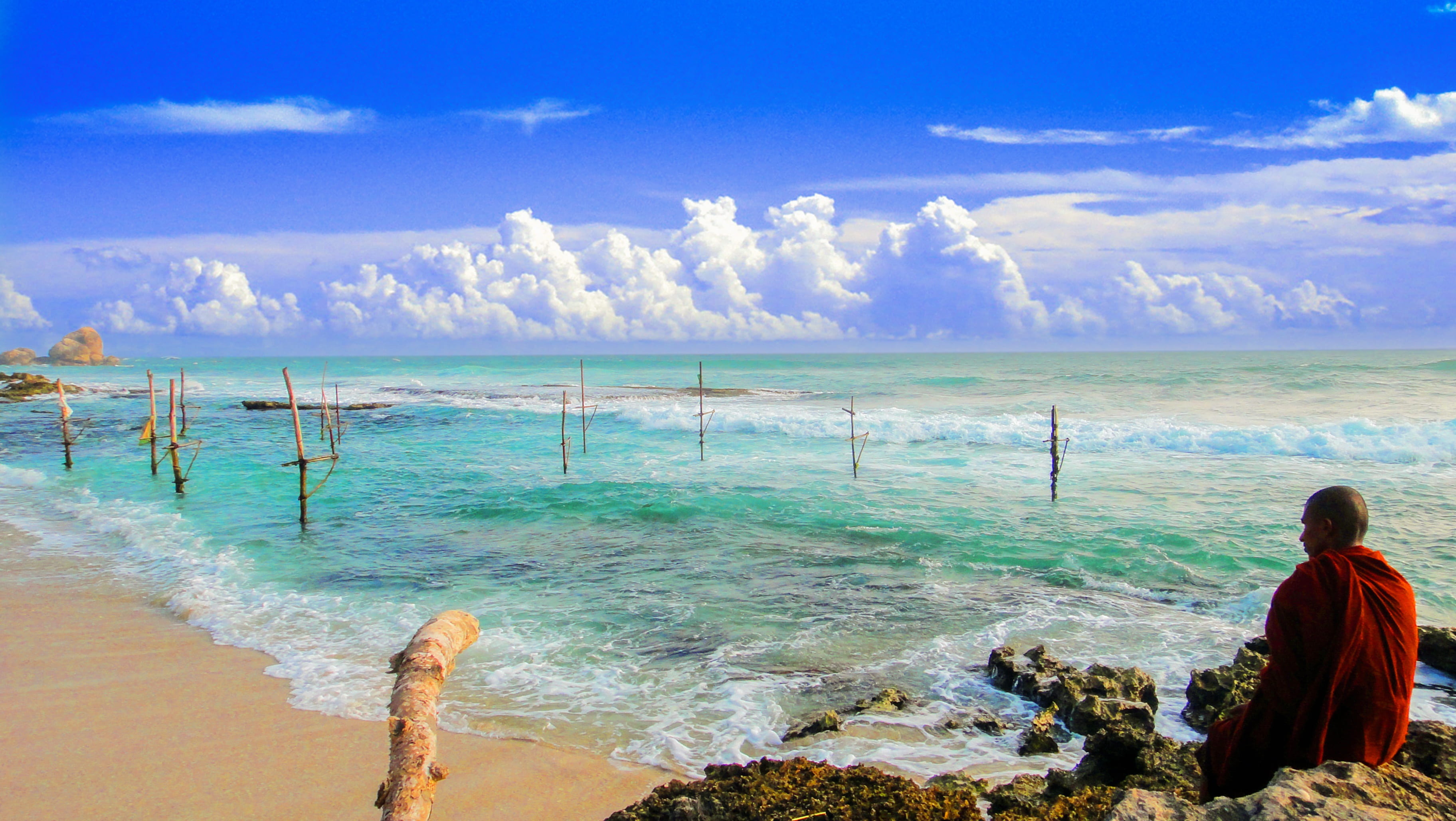 man, vacation, beach, formation, travel, shore, monk beside beach, cloud - sky, scenics - nature, sky, monk, travel destinations, near, beauty in nature, HD Wallpaper
