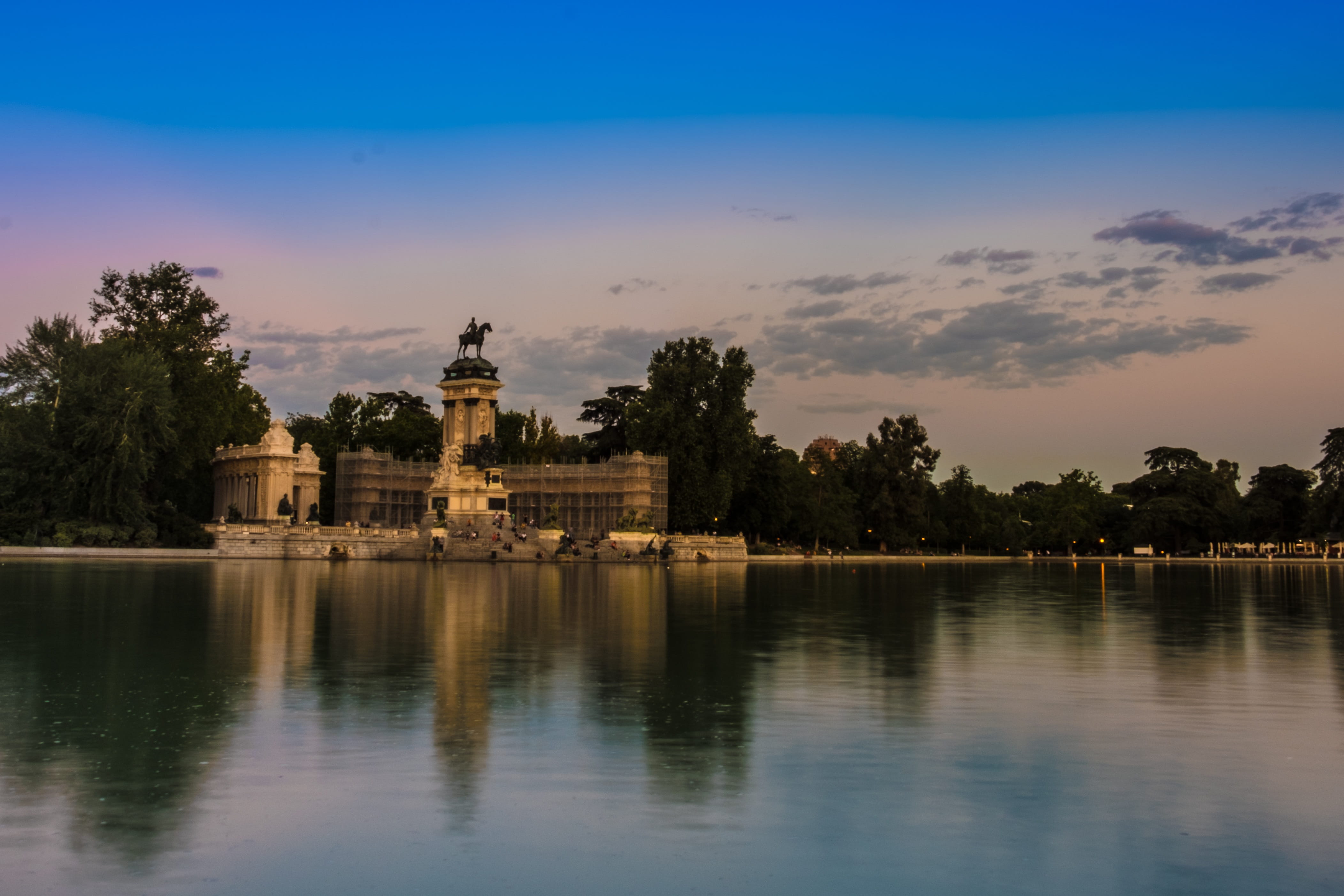 blue, belief, Retiro Park, sky, architecture, waterfront, plant, retirement, king, cloud - sky, Water, Pond, clouds, Sunset, religion, sculpture, place of worship, HD Wallpaper