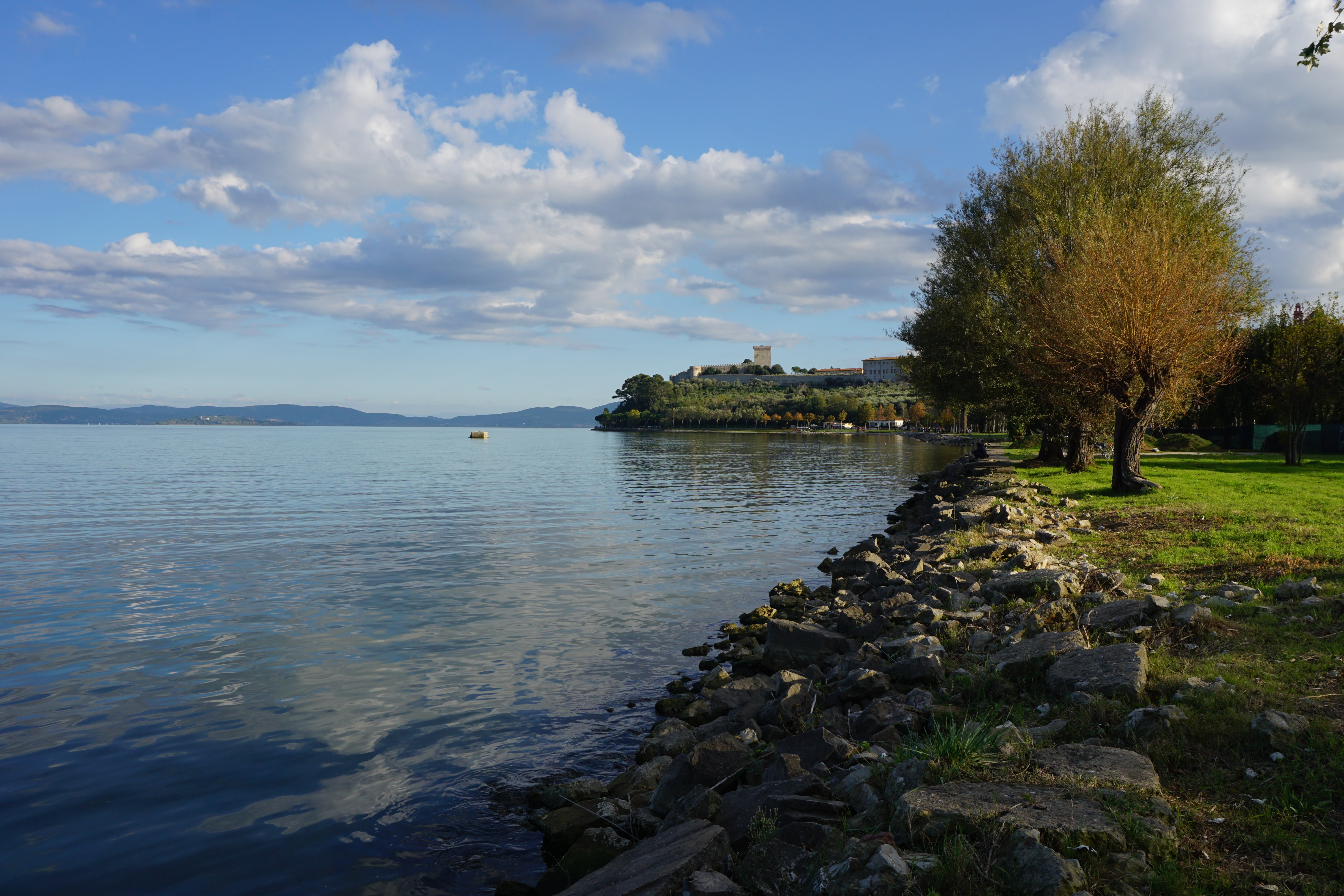 sky, lake trasimeno, clouds, body of water, castiglione del lago, beauty in nature, sea, plant, rock, 5K, tree, tranquil scene, lake, rock - object, day, HD Wallpaper