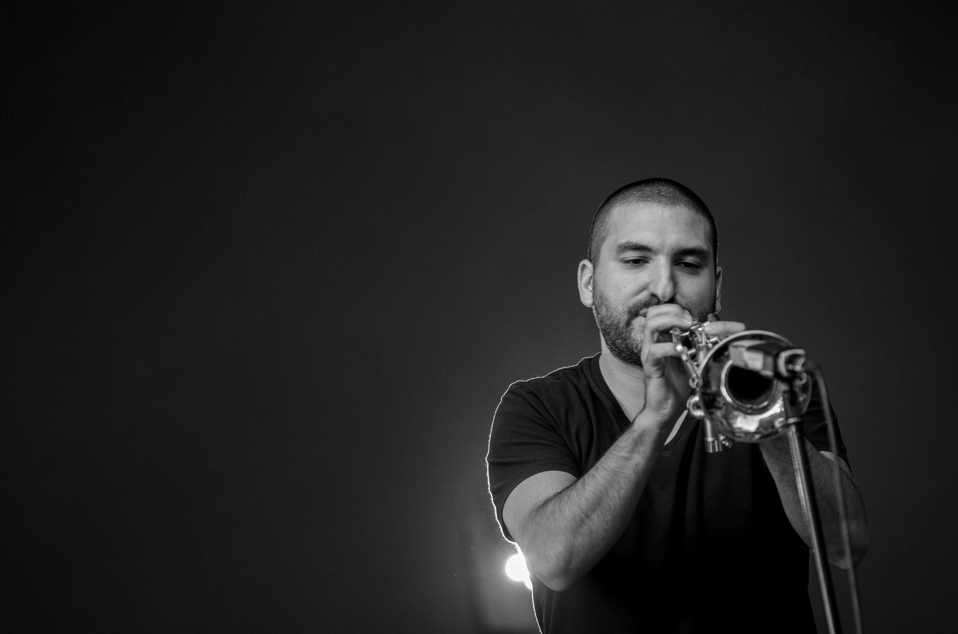 black and white, holding, performance, concert, studio shot, musical instrument, black background, copy space, skill, brass, dark, trumpet, music, arts culture and entertainment, HD Wallpaper