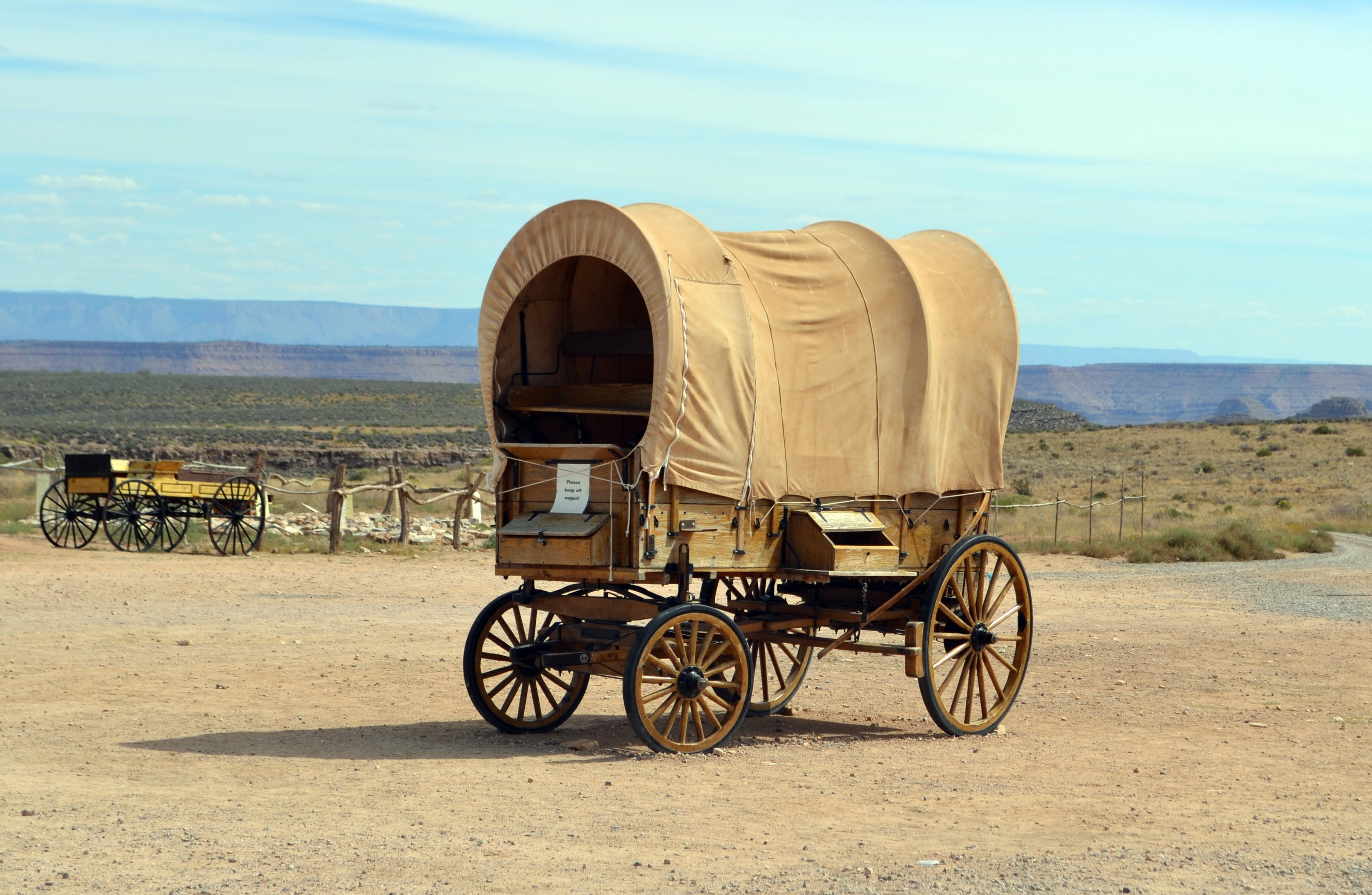 outdoors, skies, sunlight, nature, desert, sky, beauty in nature, road, brown, wagon, landscape, travel, america, non-urban scene, mode of transportation, HD Wallpaper