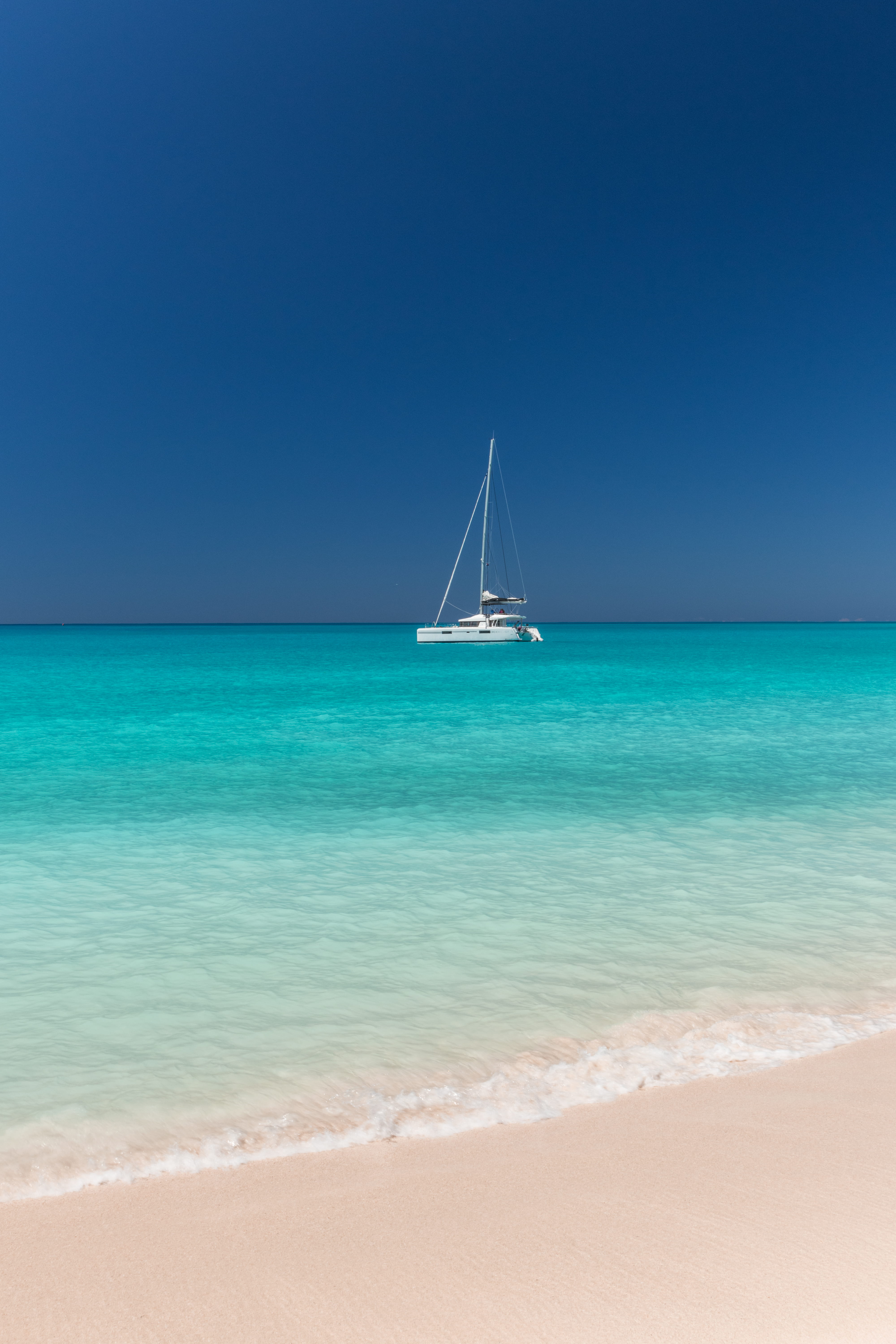 white, yacht, luxury, sea, beach, no people, transportation, nautical vessel, tranquil scene, water, 5K, caribbean, sky, sailboat, clear sky, nature, sand, Phone HD Wallpaper