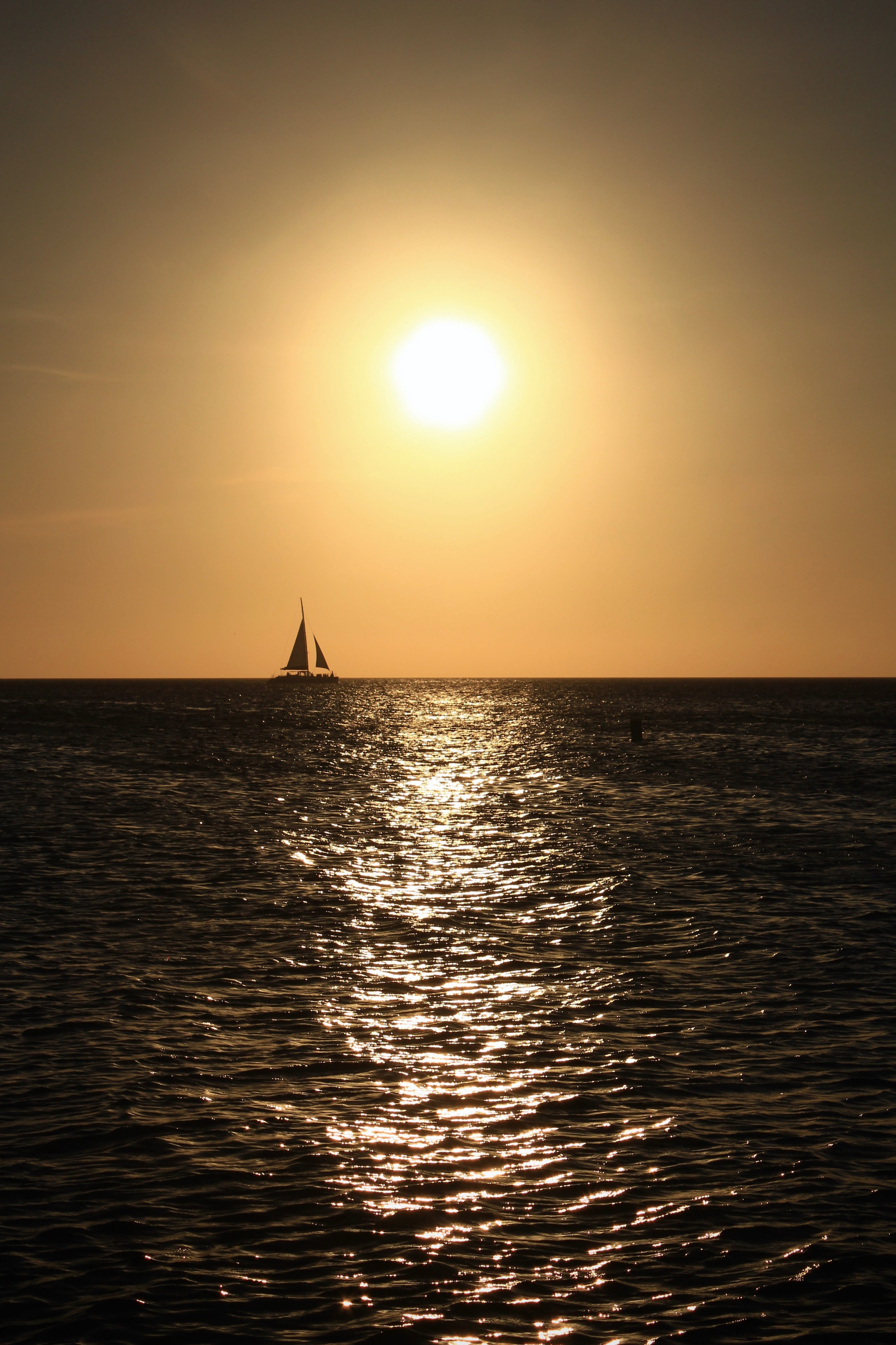 boat, horizon over water, tranquil scene, sunlight, sailing, sky, ship, 4K, silhouette, calm, sunset, sailboat, idyllic, glow, beauty in nature, tranquility, Phone HD Wallpaper