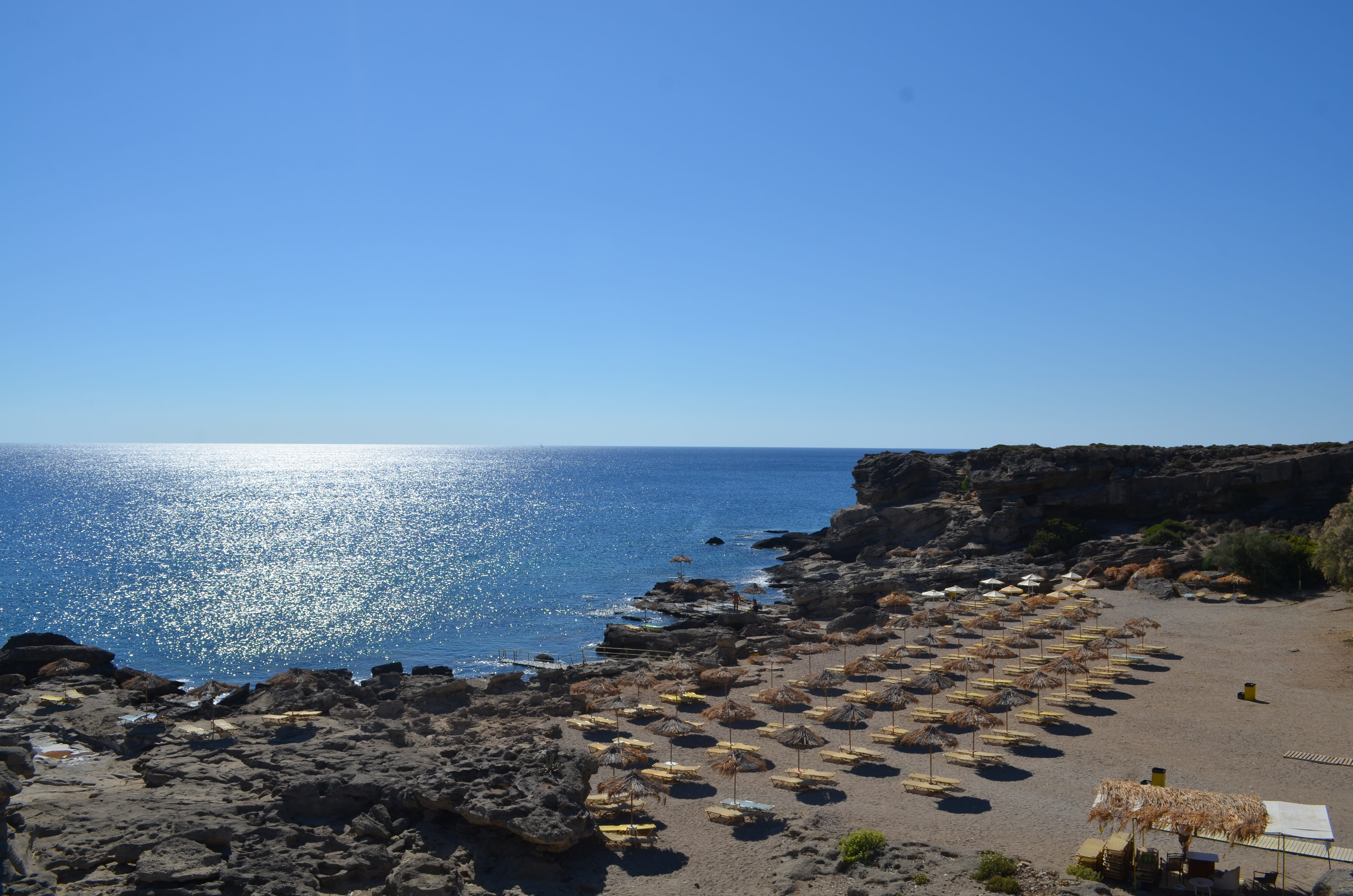 Greece, 4K, sand, horizon, outdoors, nature, rocky coastline, Beach Umbrella, clear sky, sun, rock - object, rock, solid, tranquility, day, tranquil scene, HD Wallpaper