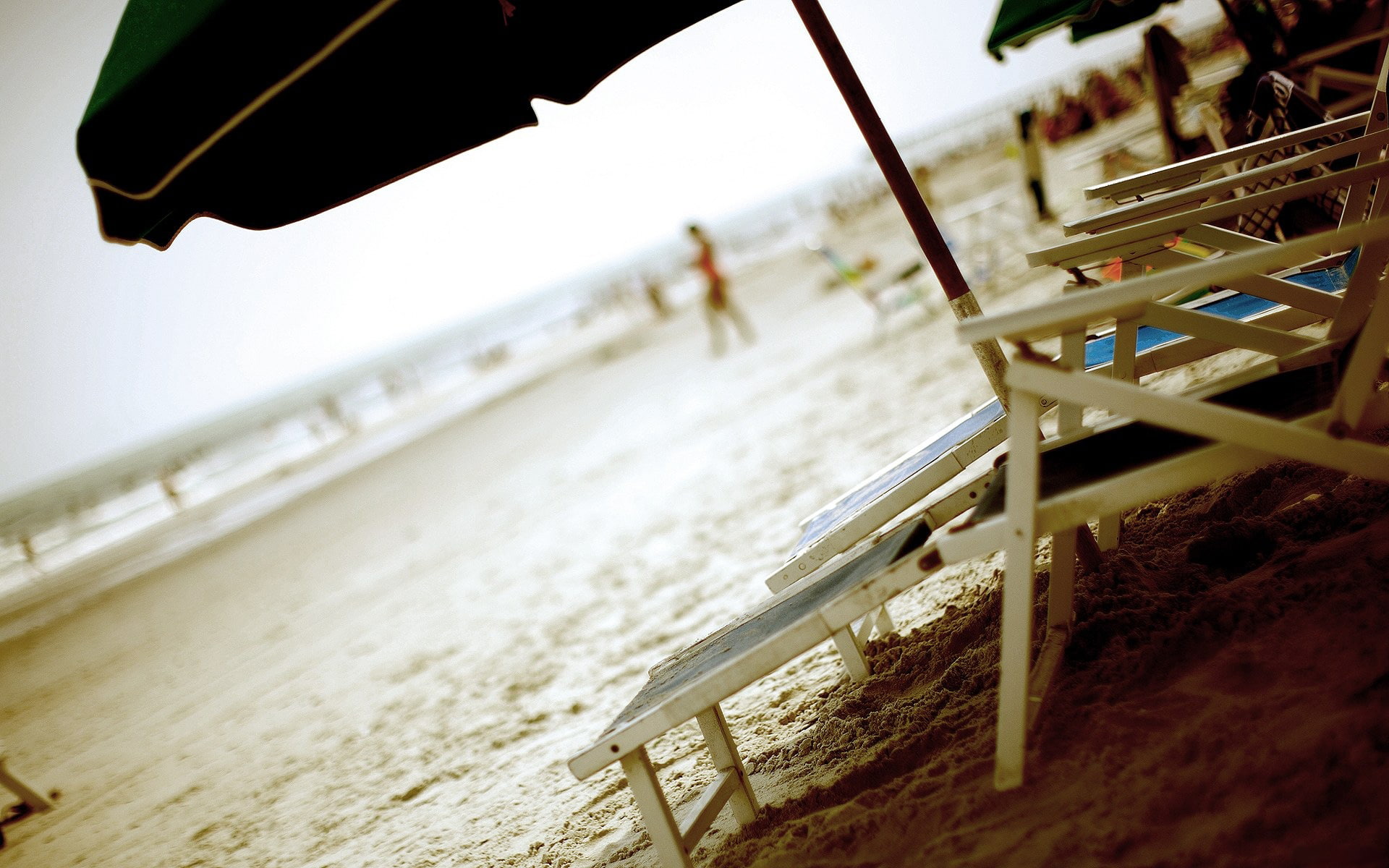 built structure, umbrella, architecture, motion, sea, outdoors, Beach, sunbeds, tilt, selective focus, sun, loungers, day, land, sand, wood - material, HD Wallpaper