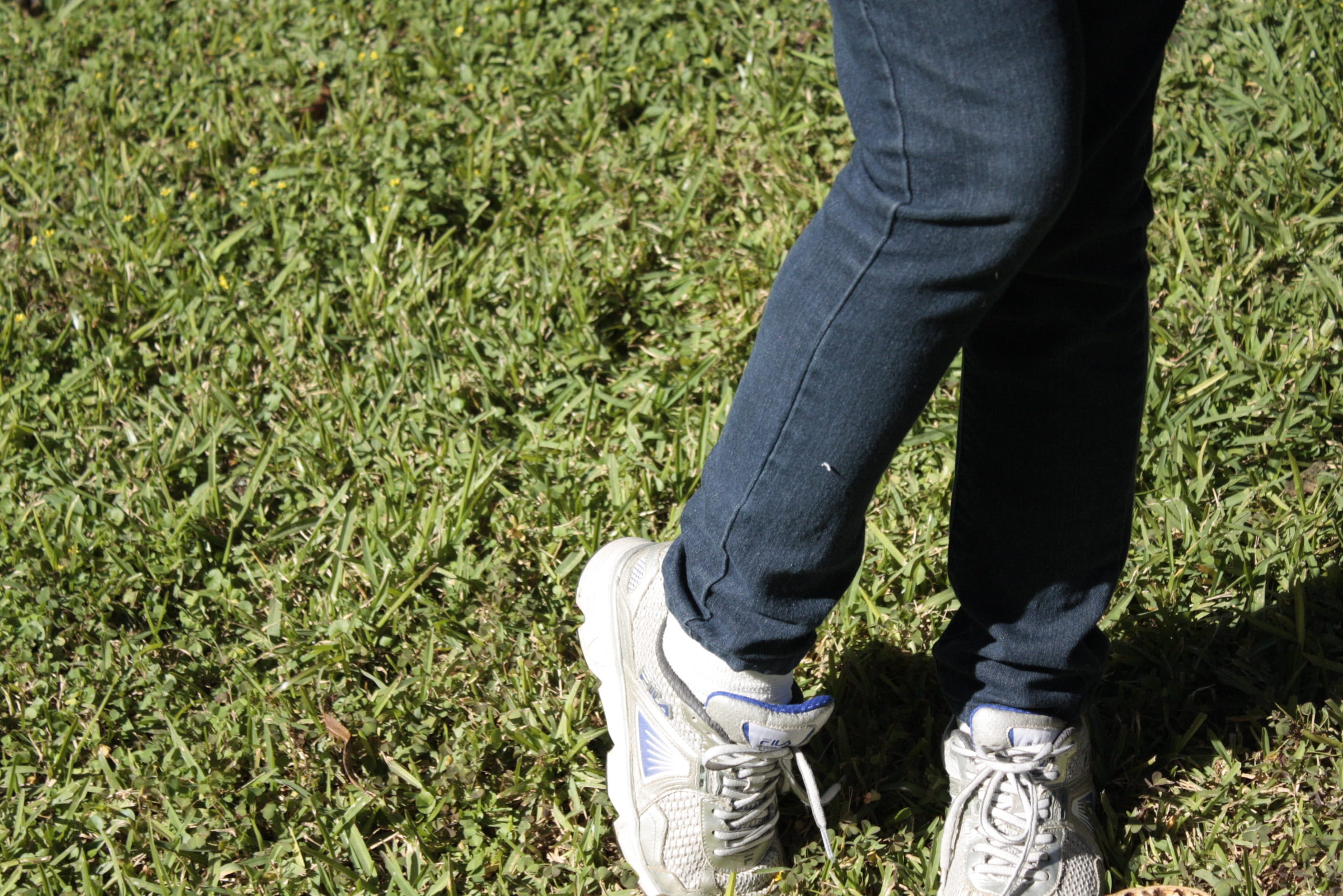 feet, human leg, shy, land, legs, jeans, one person, human foot, 2K, lifestyles, plant, sunlight, tennis, jean, day, field, standing, nature, grass, body part, HD Wallpaper