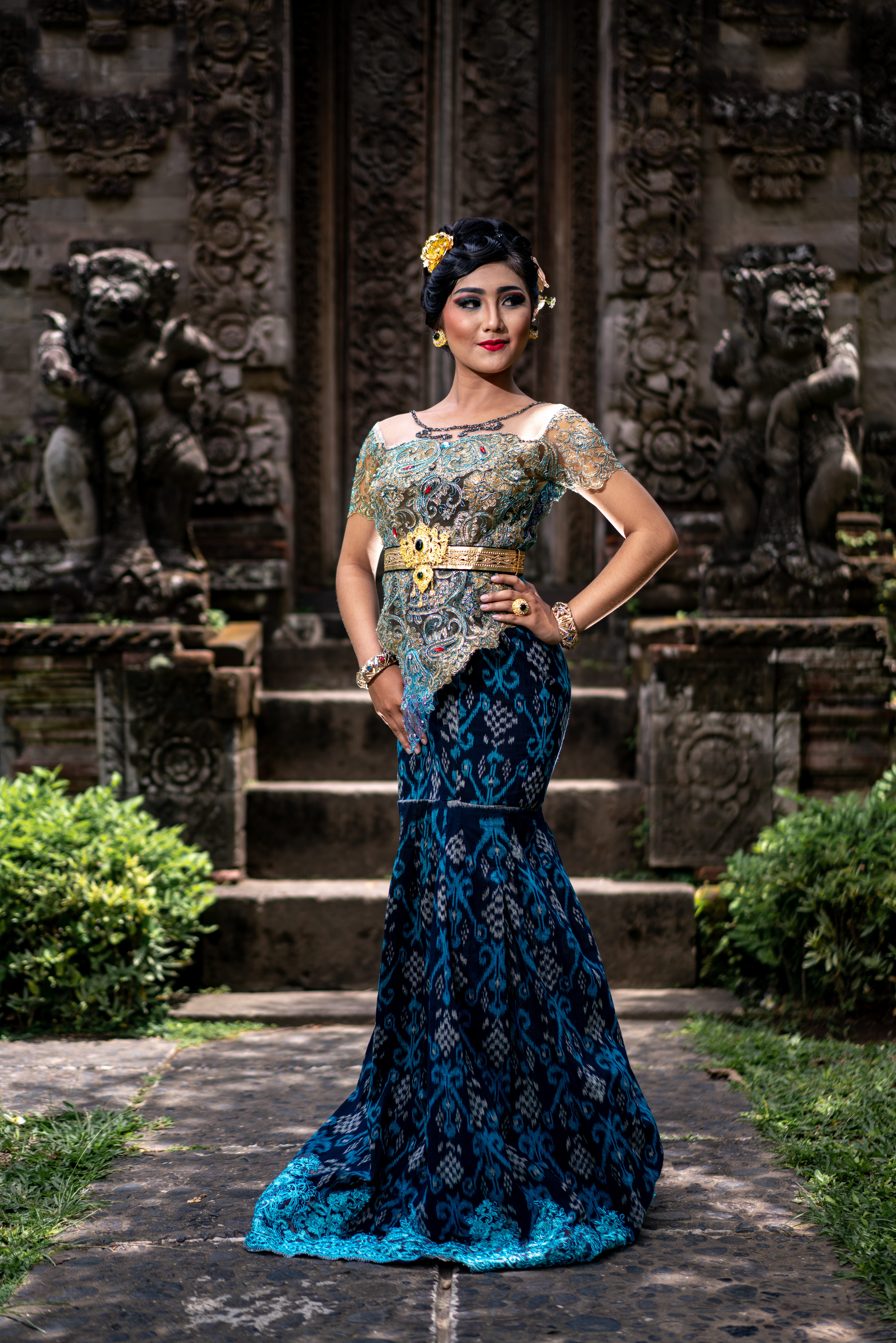 balinese girl, standing, women, sculpture, adult, ornate, dress, hand, beauty, architecture, one person, 8K, built structure, fashion, hairstyle, balinese culture, Phone HD Wallpaper