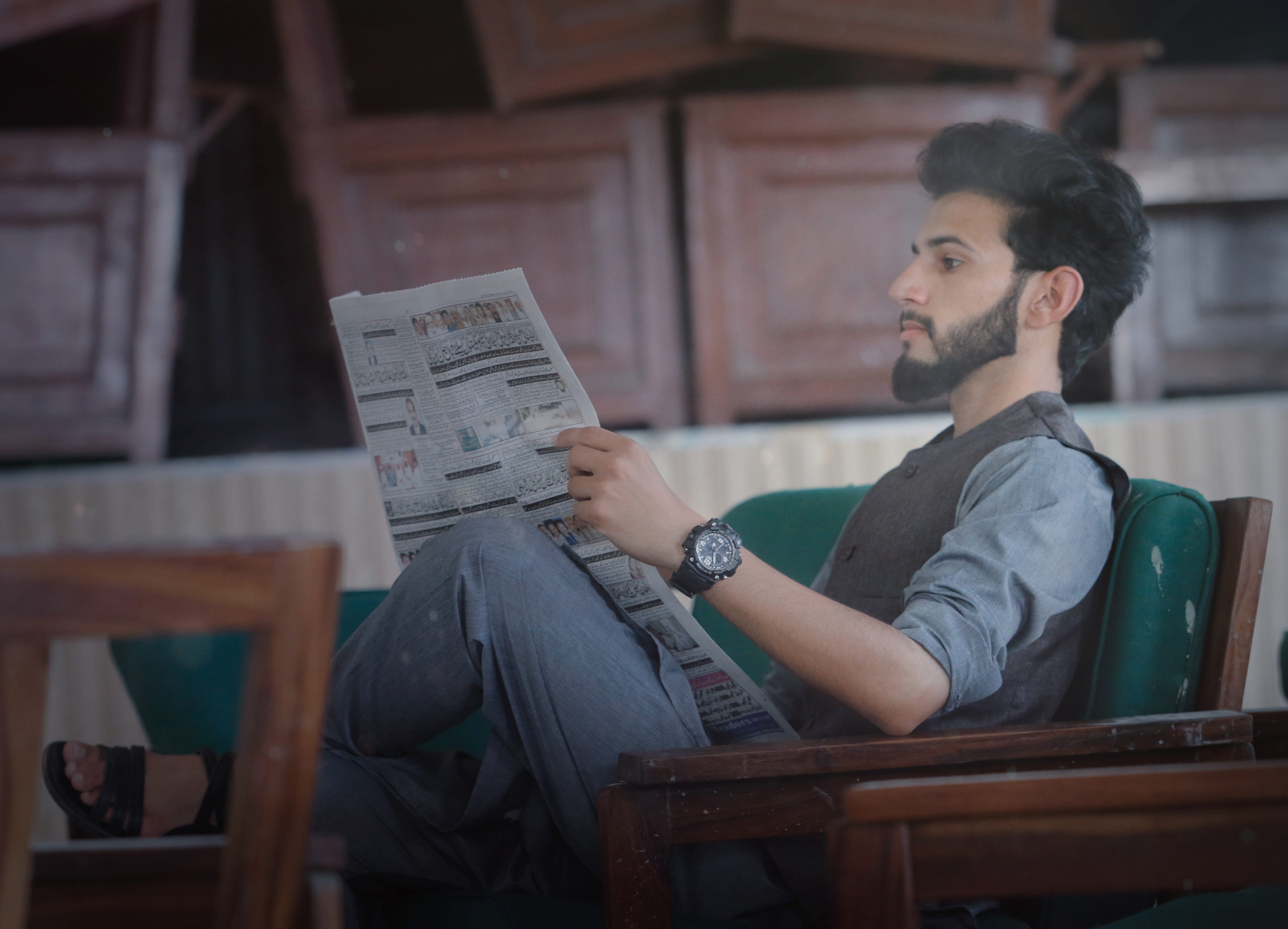 model, male model, sitting, 4K, real people, newspaper, one person, reading, holding, indoors, hairstyle, chair, three quarter length, seat, pakistan, HD Wallpaper