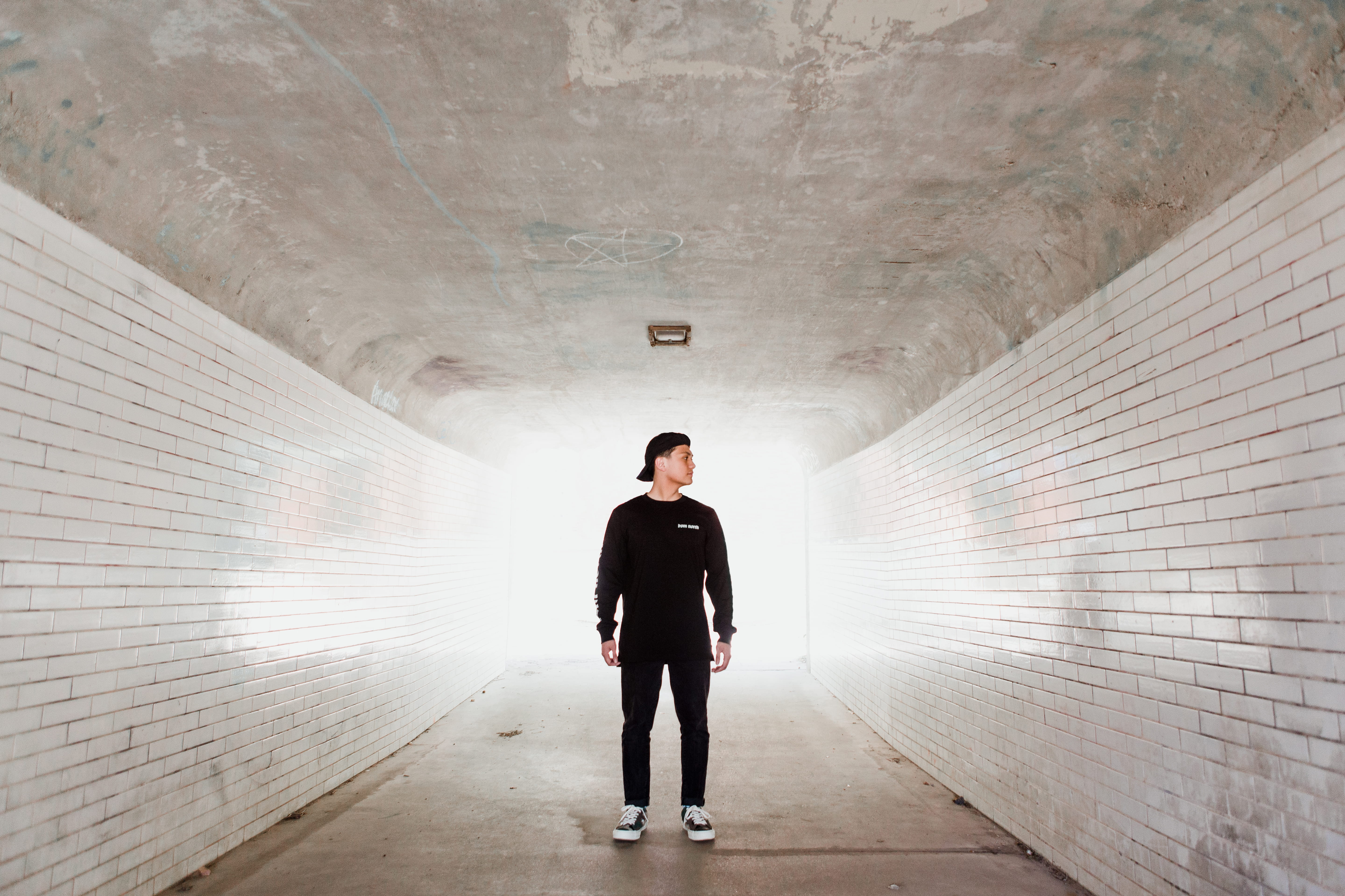 pathway, bricks, male, street, daytime, urban, one person, direction, mid adult, built structure, 5K, looking, indoors, tunnel, black, building, architecture, HD Wallpaper
