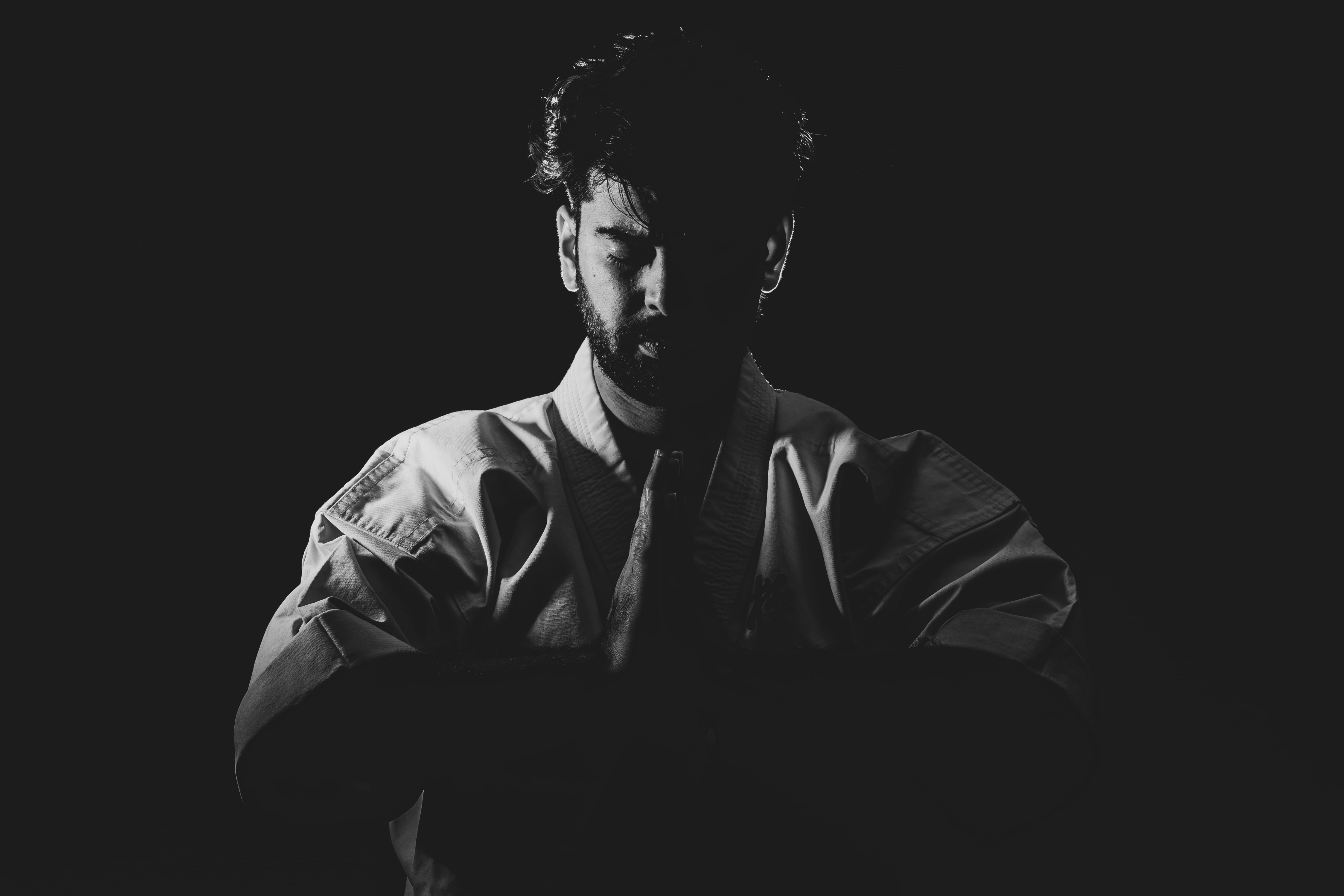 black background, casual clothing, depression - sadness, indoors, looking, males, lifestyles, copy space, artist, waist up, front view, human face, sitting, HD Wallpaper