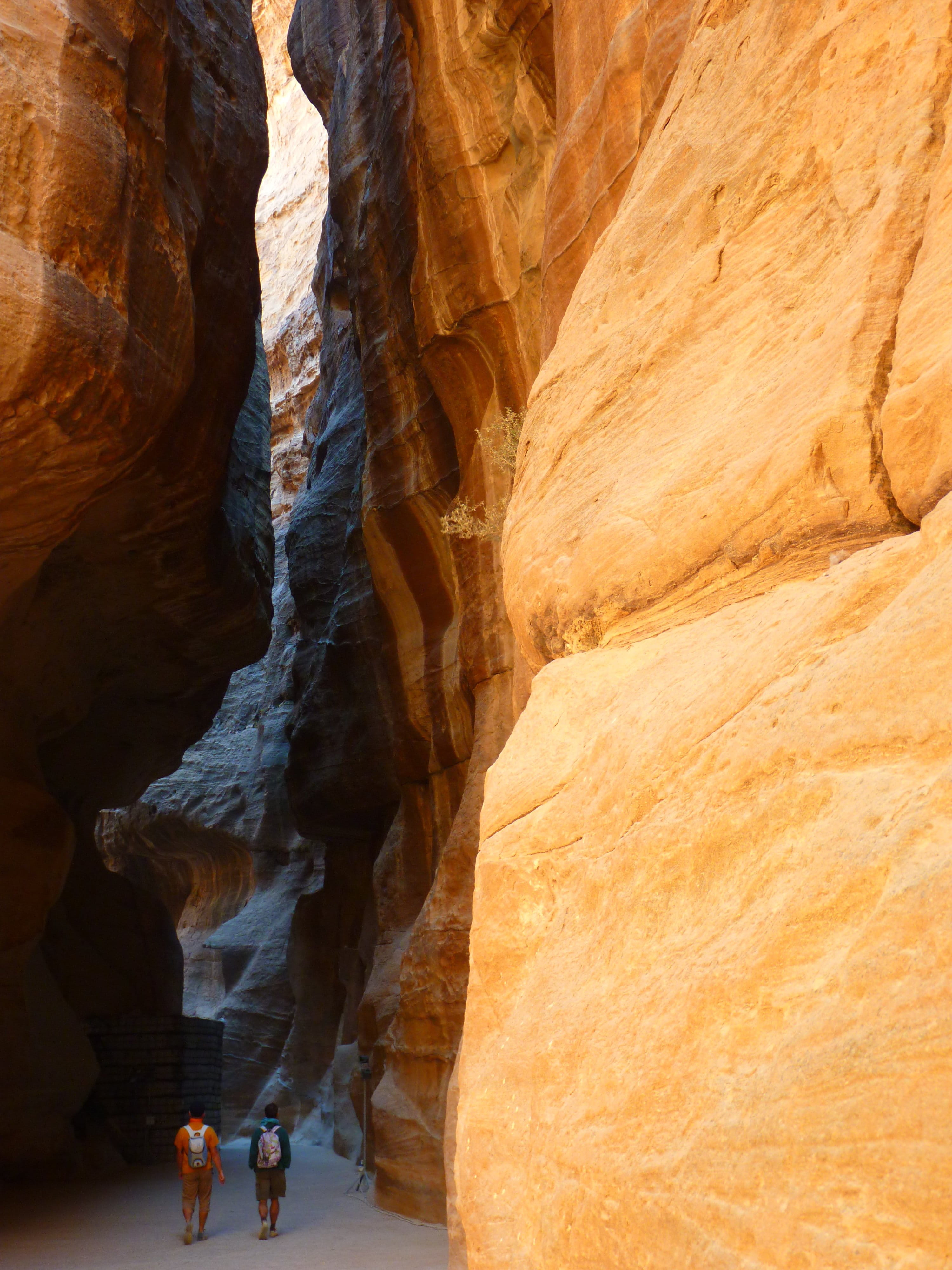 desert, adult, no people, day, Siq, Holiday, formation, tourism, physical geography, rock - object, rock formation, rock, geology, cave, beauty in nature, Phone HD Wallpaper