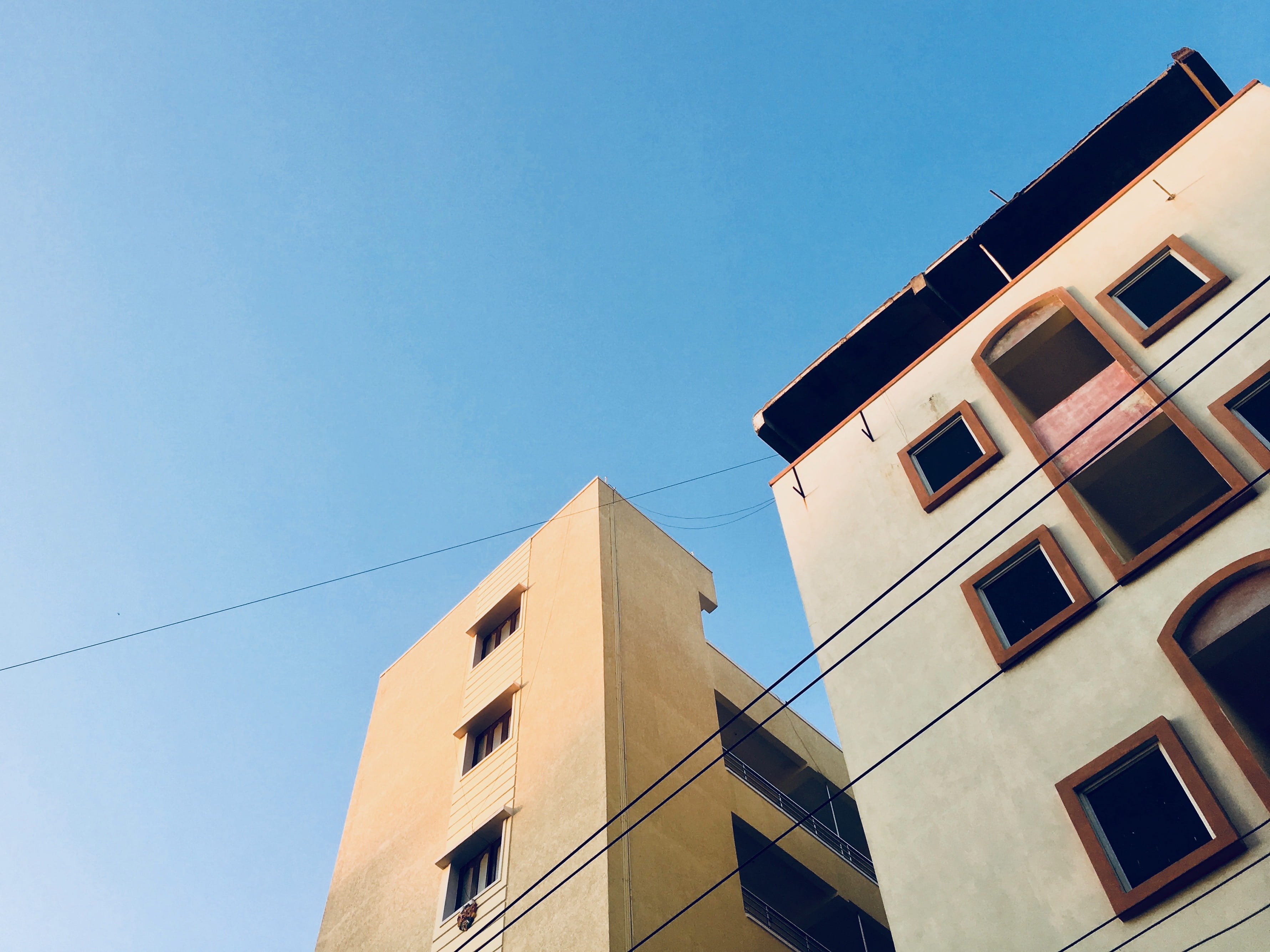 sky, building exterior, no people, copy space, hyderabad, built structure, outdoors, day, city, blue, buildings, architecture, low angle view, building, HD Wallpaper