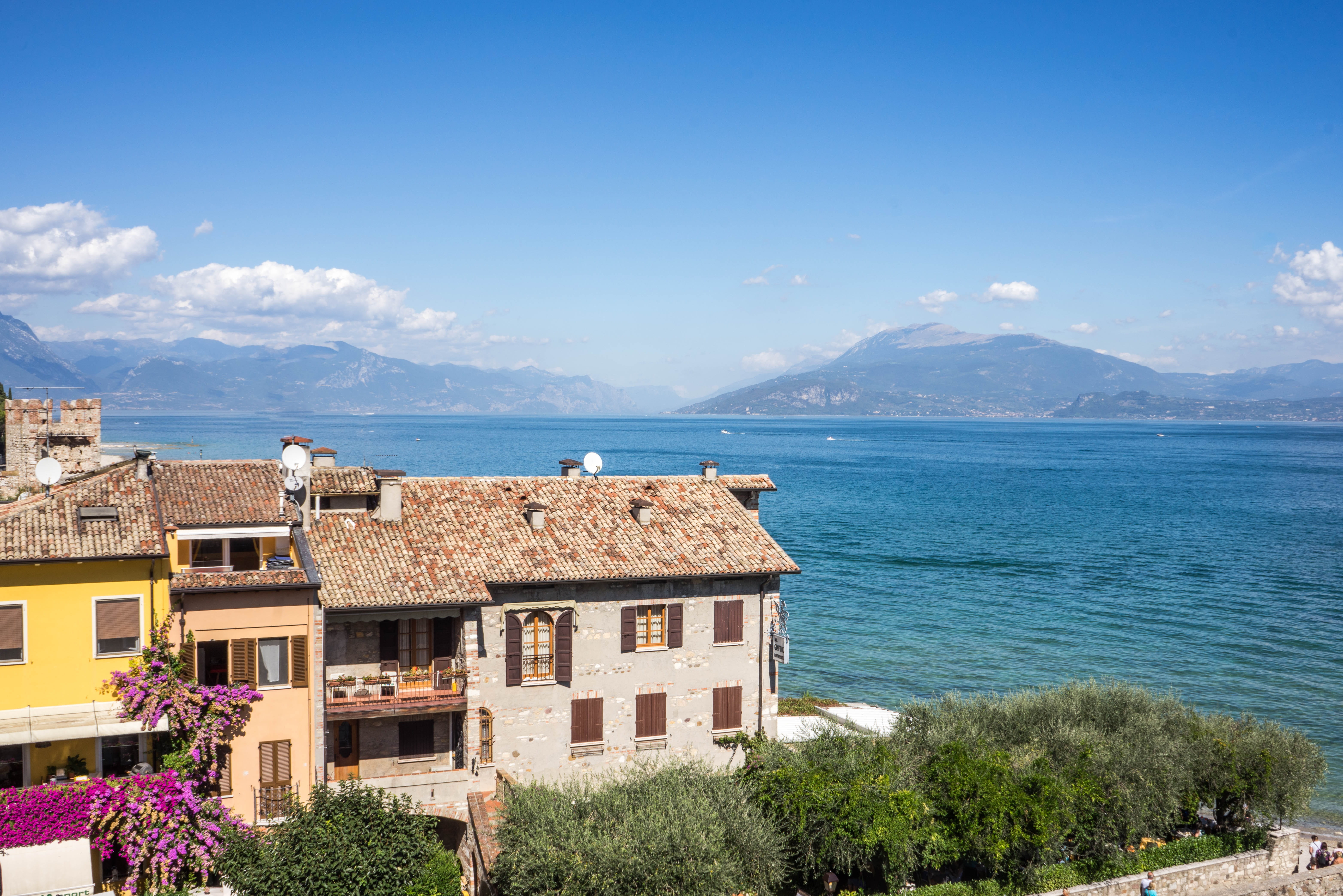 water, architecture, sirmione, lombardy, mountain range, mountains, flowering plant, plant, landscape, beauty in nature, vacation, scaliger, blue, built structure, HD Wallpaper