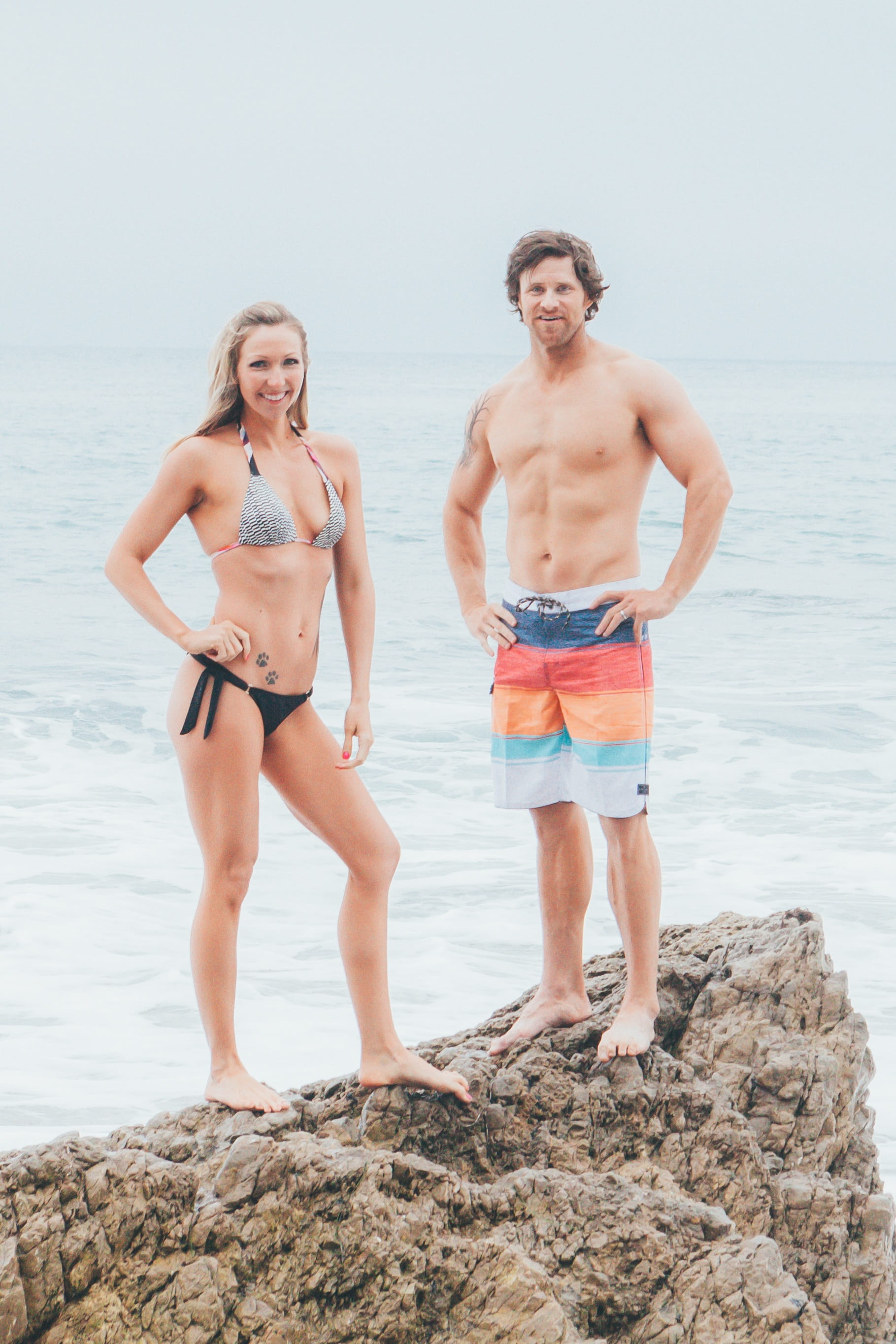 couple - relationship, beach, swimwear, togetherness, smiling, posted, men, active, holiday, leisure activity, shirtless, full length, 2K, nature, two people, Phone HD Wallpaper