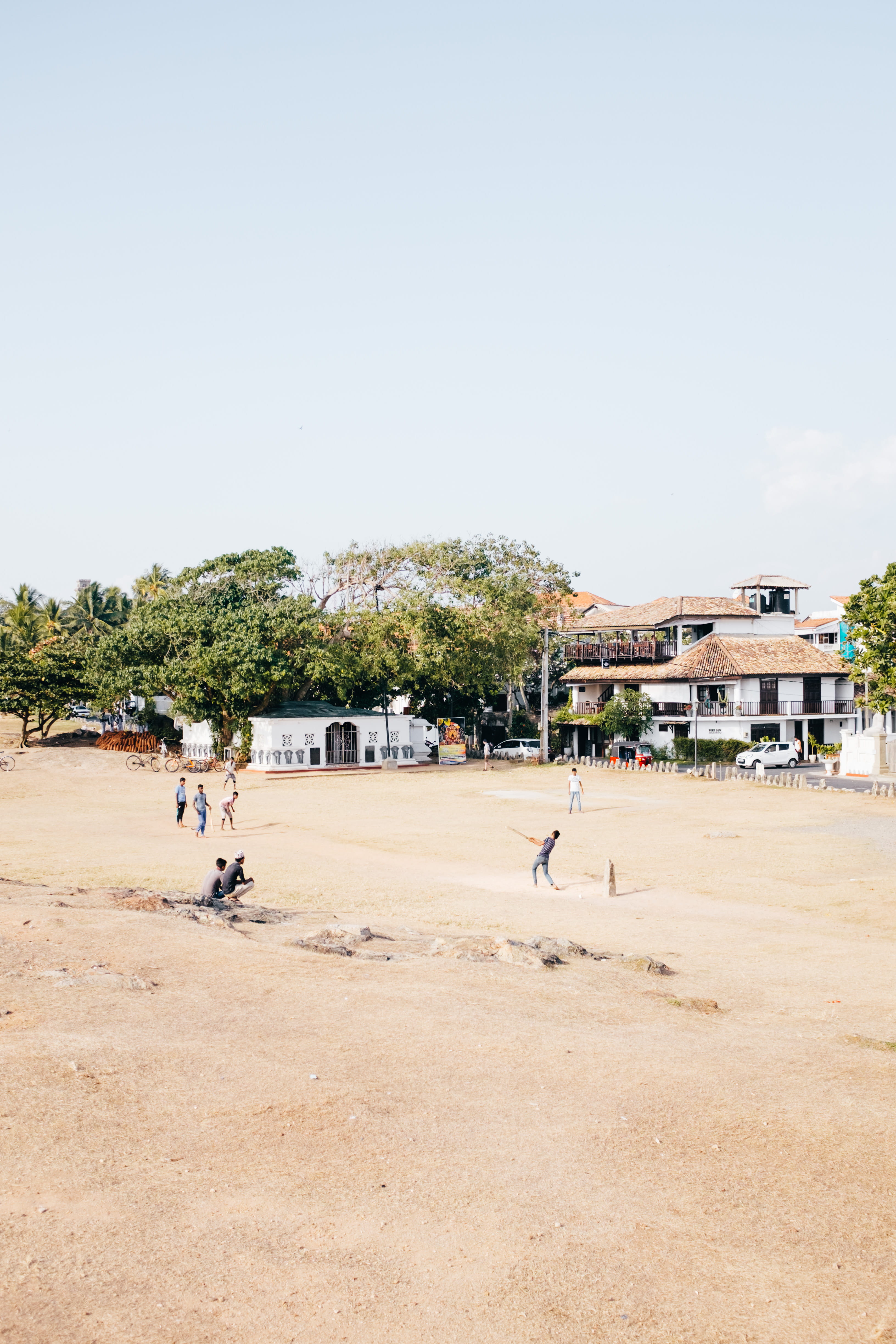 cricket, sun, land, playing, clear sky, real people, architecture, built structure, kids, sport, sand, men, nature, sky, tree, 4K, incidental people, copy space, Phone HD Wallpaper