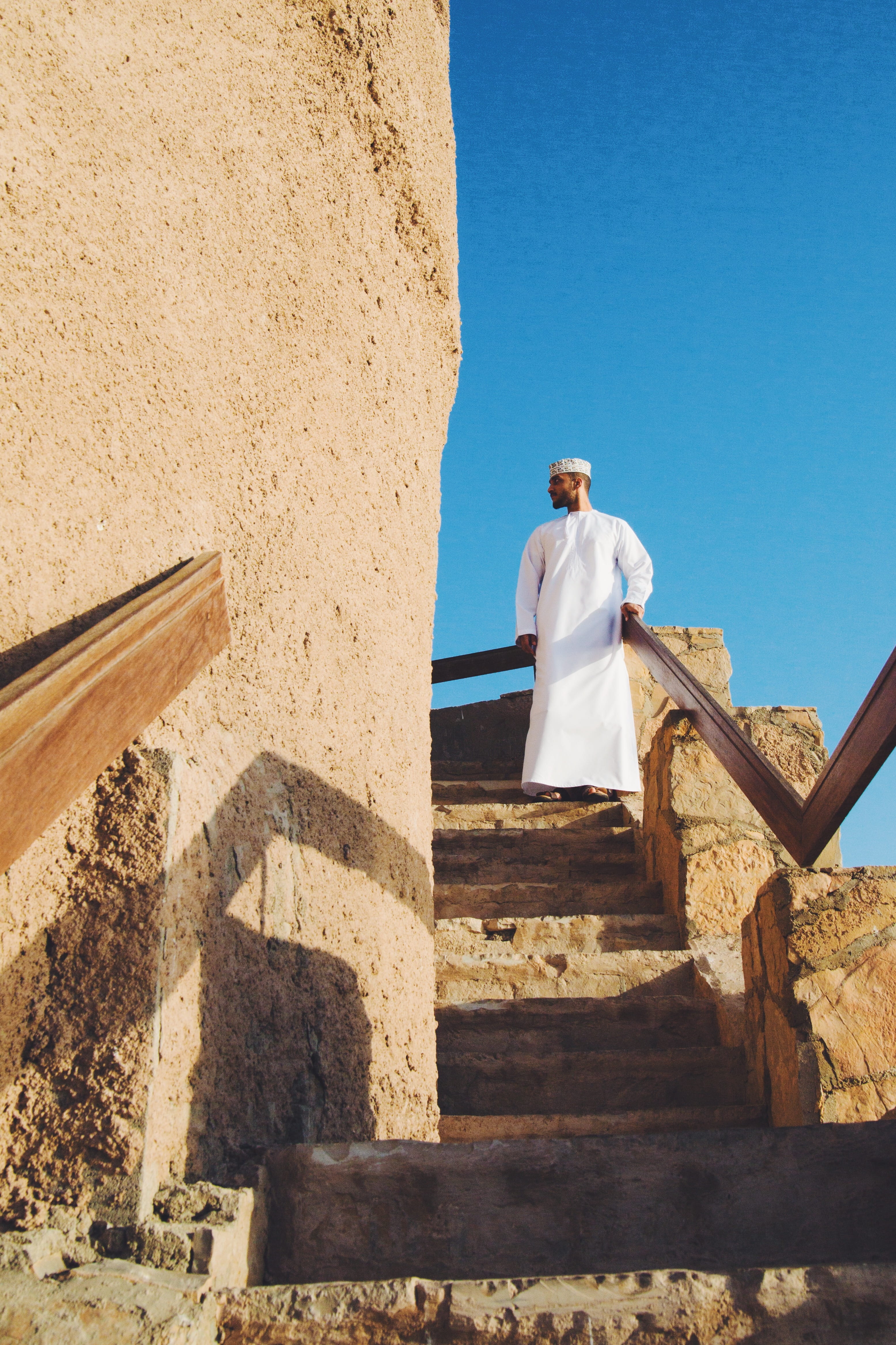 muscat, oman, staircase, outdoors, real people, nature, religion, wall - building feature, men, rear view, day, shadow, souq, architecture, omani, built structure, Phone HD Wallpaper