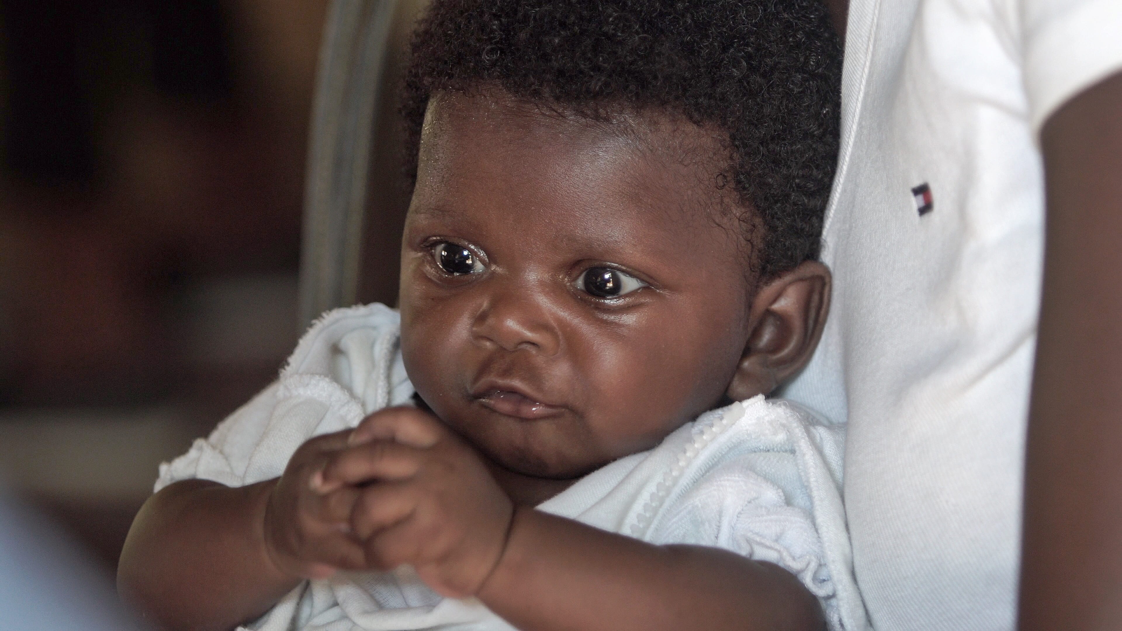 innocence, people, young, smile, portrait, babyhood, indoors, small, 4K, offspring, human hand, white, haiti, shirt, relaxation, baby, haitian baby, child, HD Wallpaper