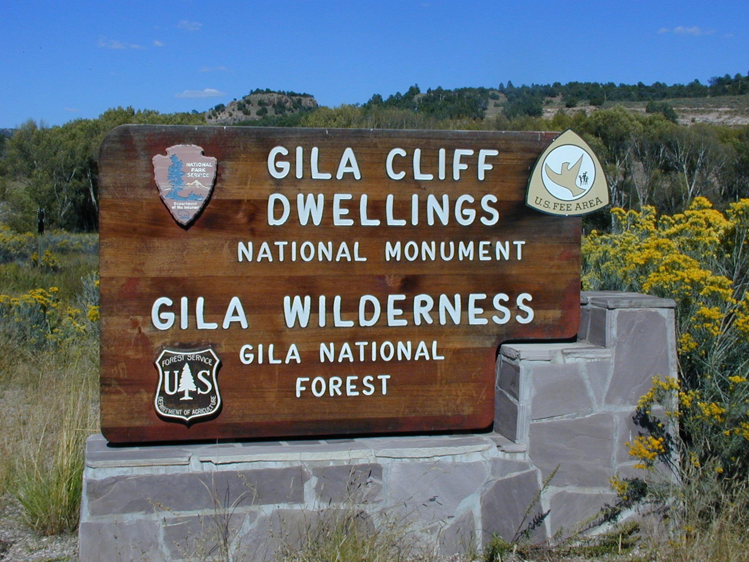 text, input, symbol, wood - material, outdoors, western script, direction, gila wilderness, plant, tree, information sign, communication, sign, clear sky, HD Wallpaper