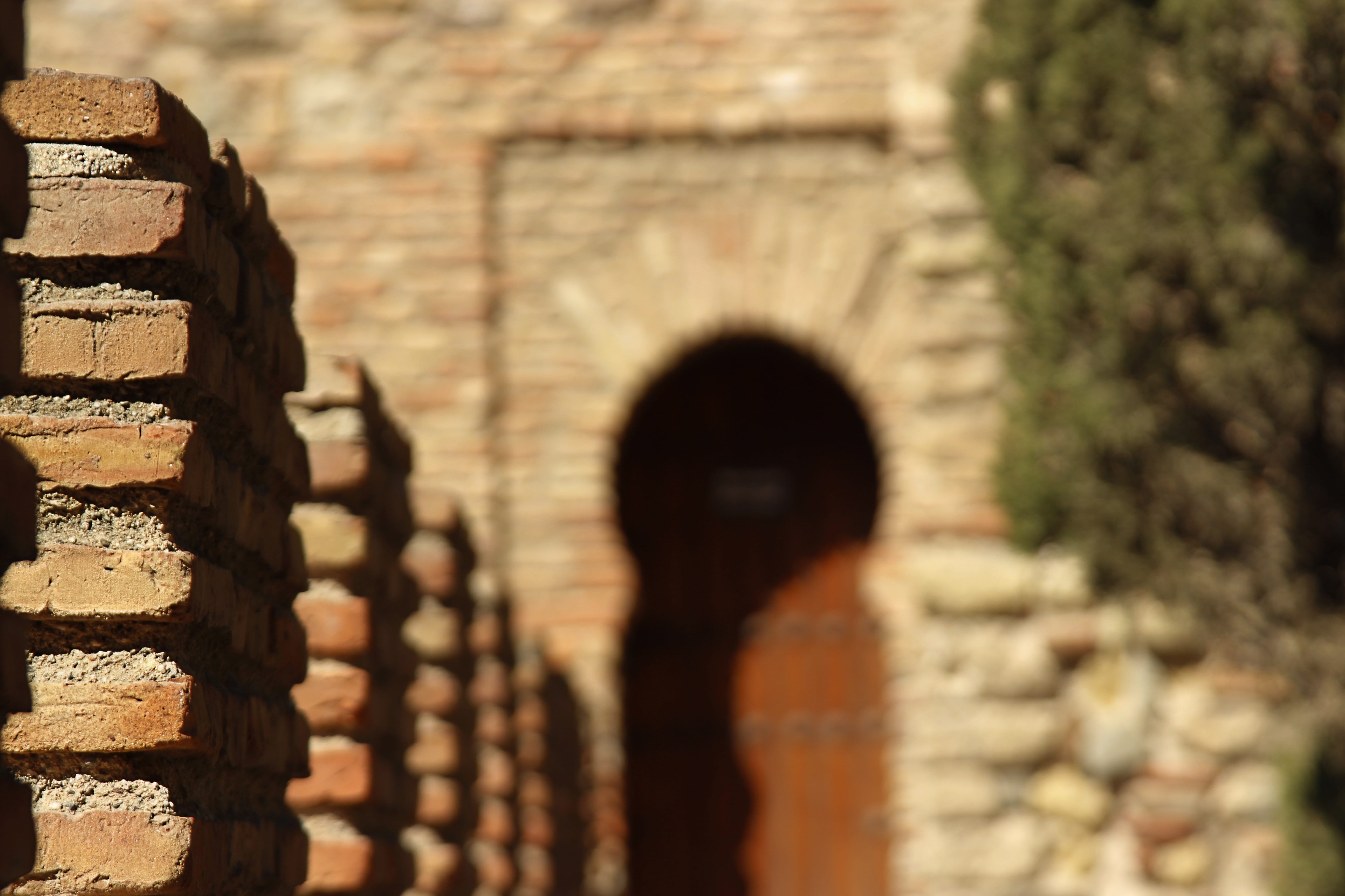 outdoors, focus on foreground, one person, stone wall, alcazaba, leisure activity, brick, the past, day, building exterior, wall, 5K, malaga, Wall, wall - building feature, HD Wallpaper