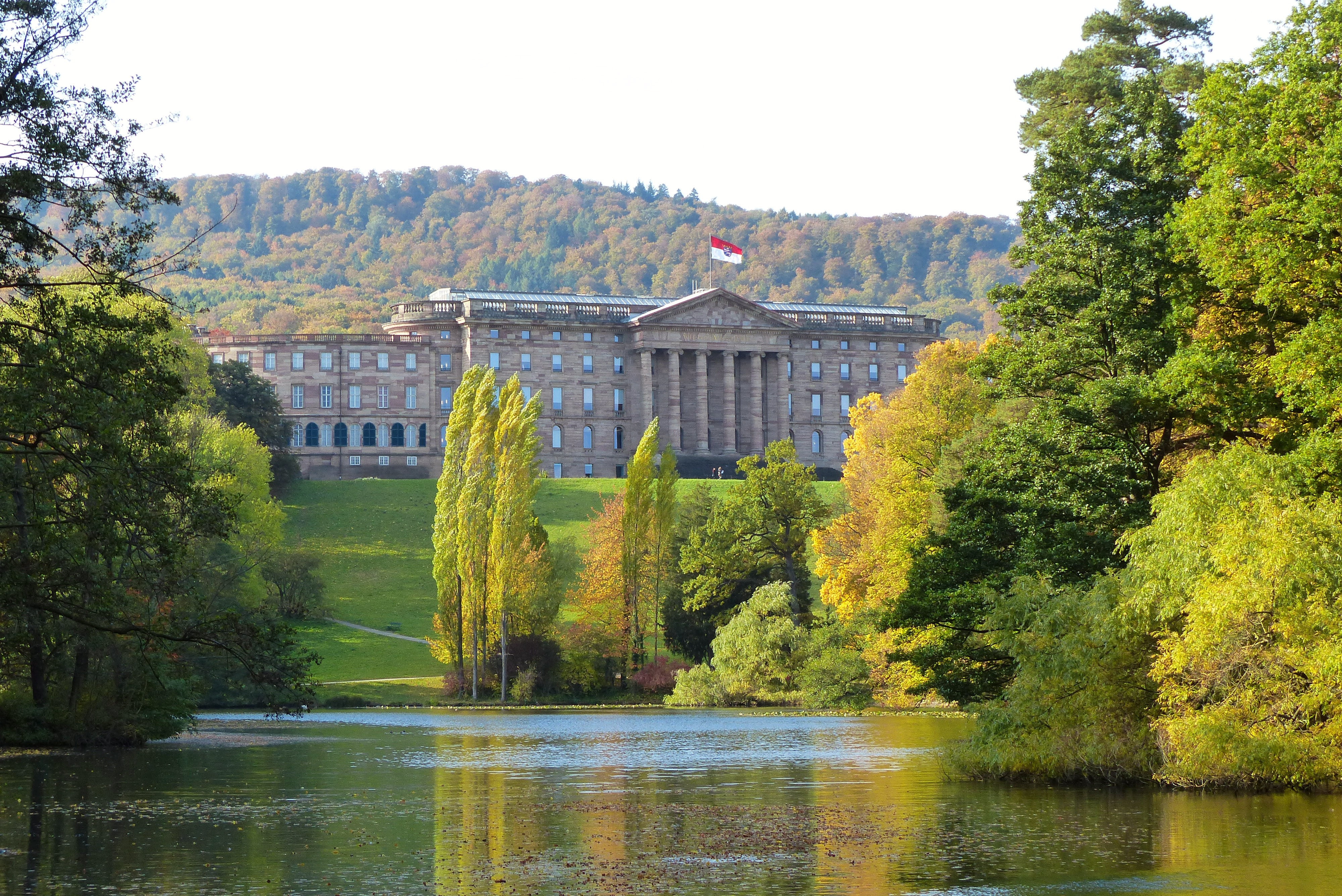 wilhelmshöhe, day, green color, building exterior, lake, clear sky, hesse, plant, tree, landmark, unique, water, outdoors, landscape, 4K, waterfront, world heritage, HD Wallpaper