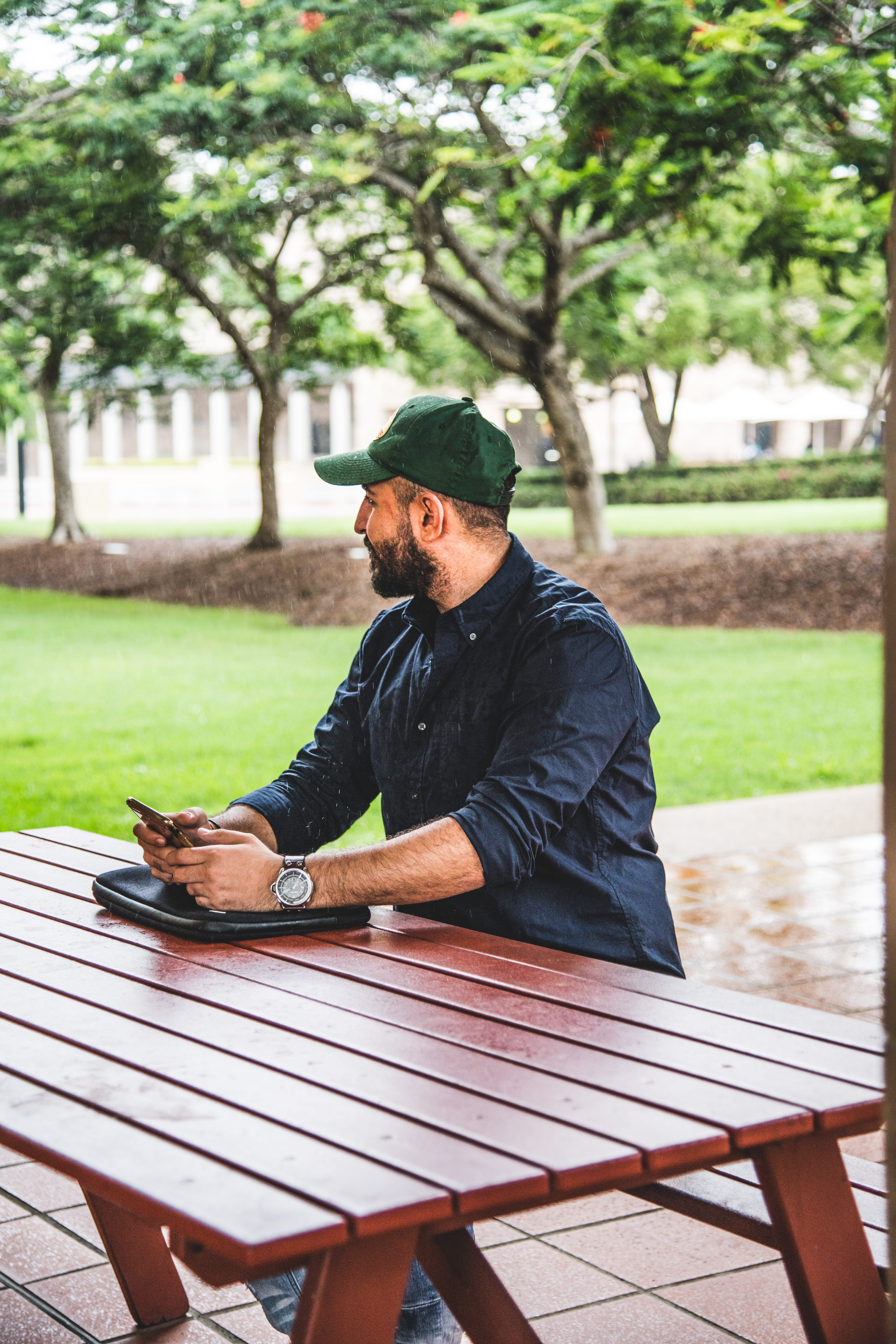 nikon d850, plant, portrait, beard, outdoors, cap, real people, one person, focus on foreground, 8K, young men, wild, lifestyles, brown, university, wood, Phone HD Wallpaper