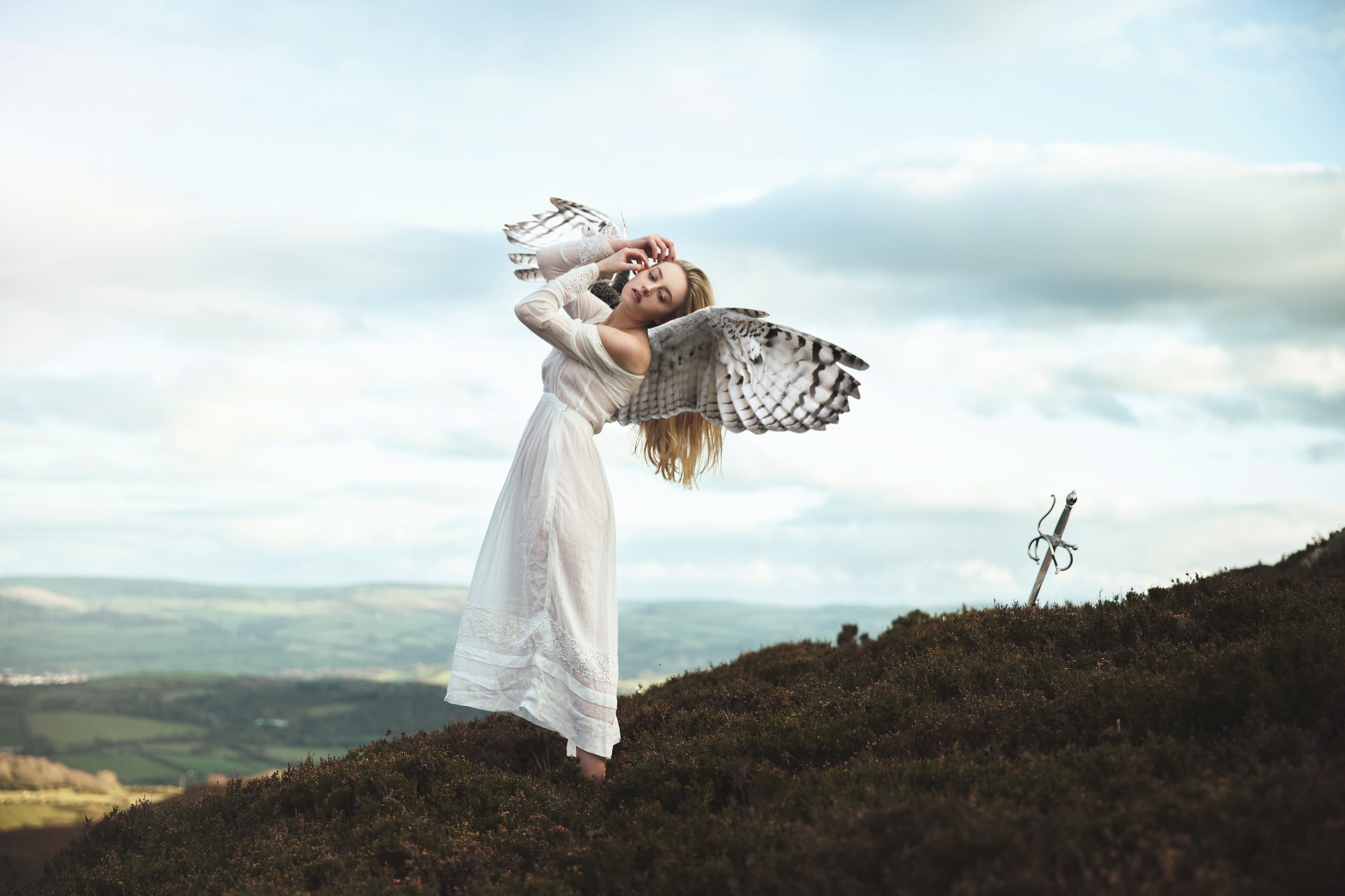 blonde, girl, height, art, long-haired, the sky, wings, angel, mood, 5K, pose, mountains, the situation, dress, clouds, fantasy, hill, sword, HD Wallpaper